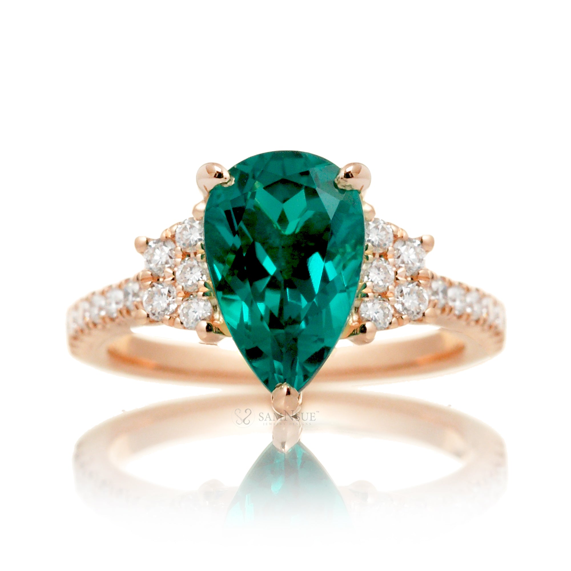 Pear emerald diamond three stone ring in rose gold the Taylor