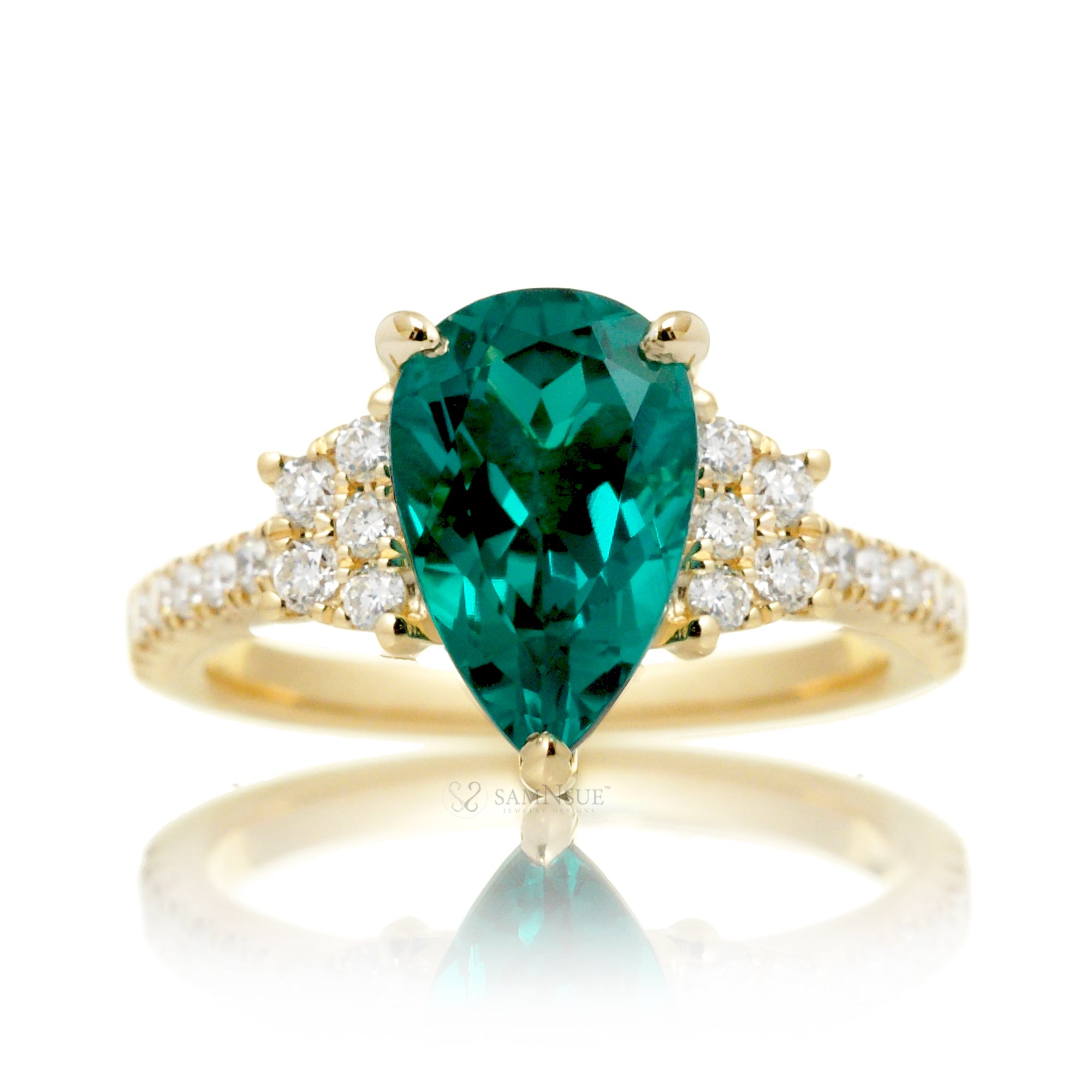 Pear emerald diamond three stone ring in yellow gold the Taylor