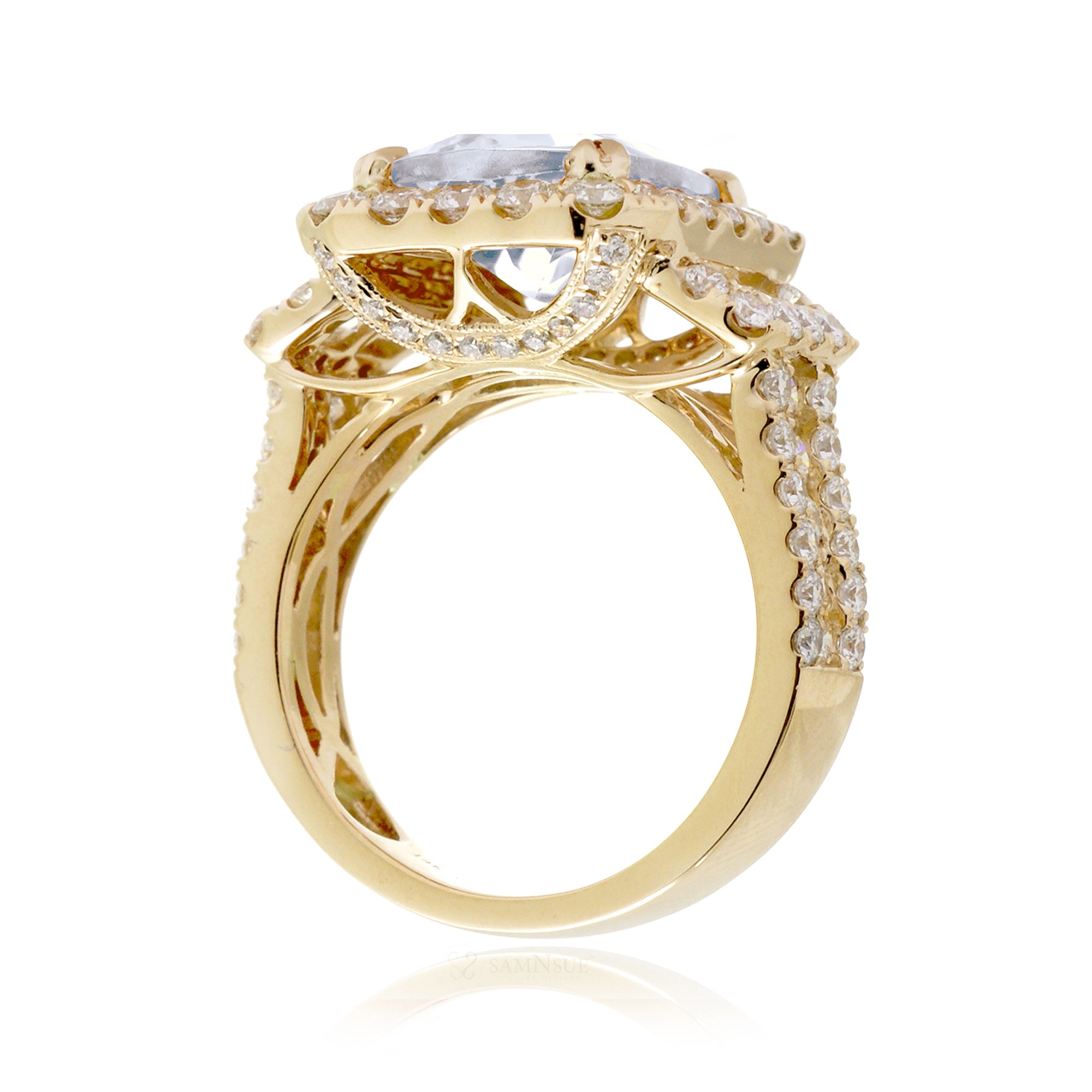 Bold Emerald Cut Diamond Halo Ring in Yellow Gold