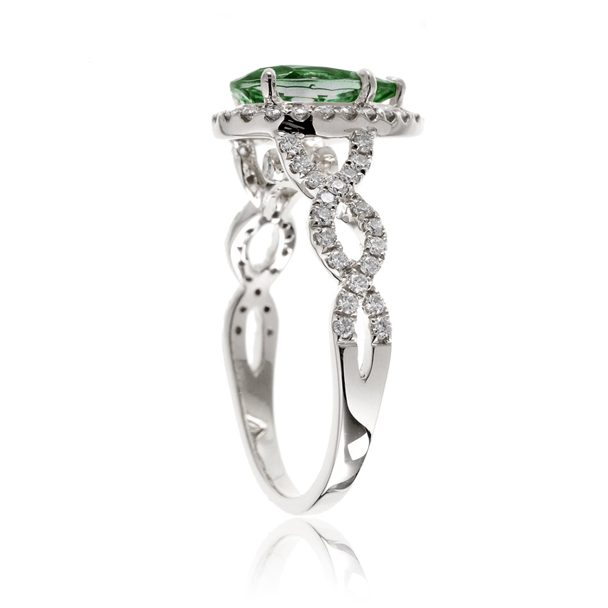 pear emerald diamond halo ring with twisted band white gold