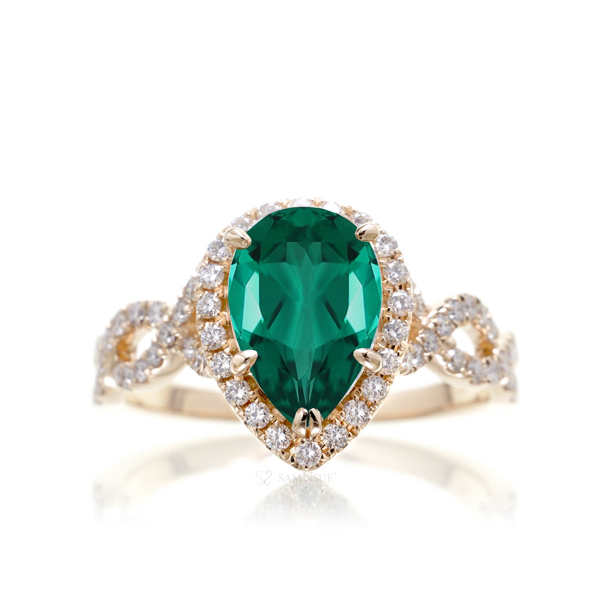 pear emerald diamond halo ring with twisted band yellow gold