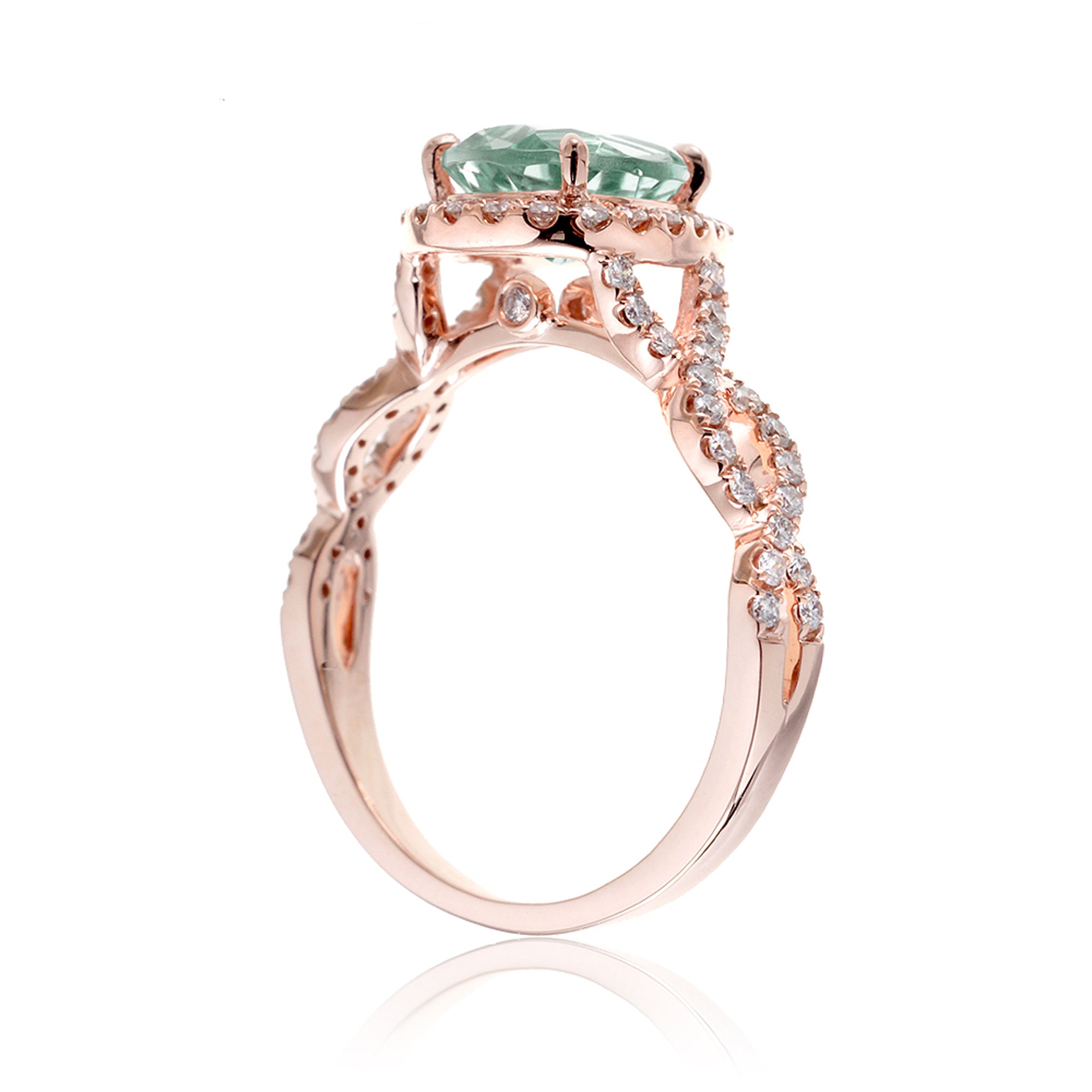 Twist band diamond halo ring with pear green sapphire rose gold