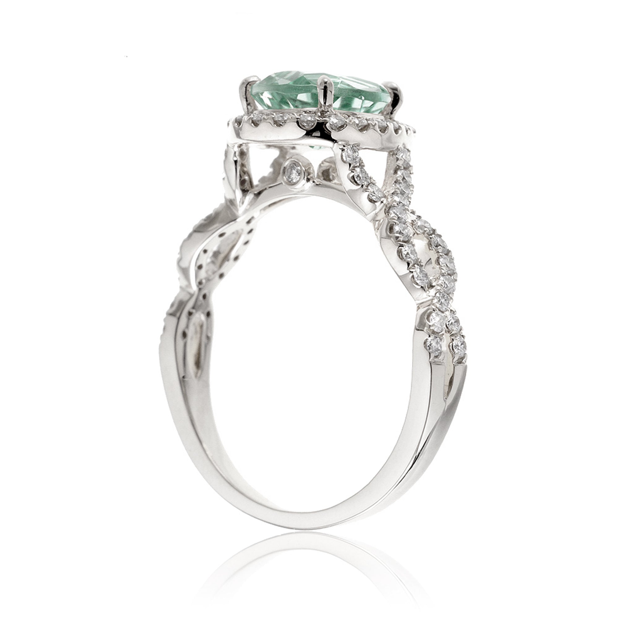 Twist band diamond halo ring with pear green sapphire white gold
