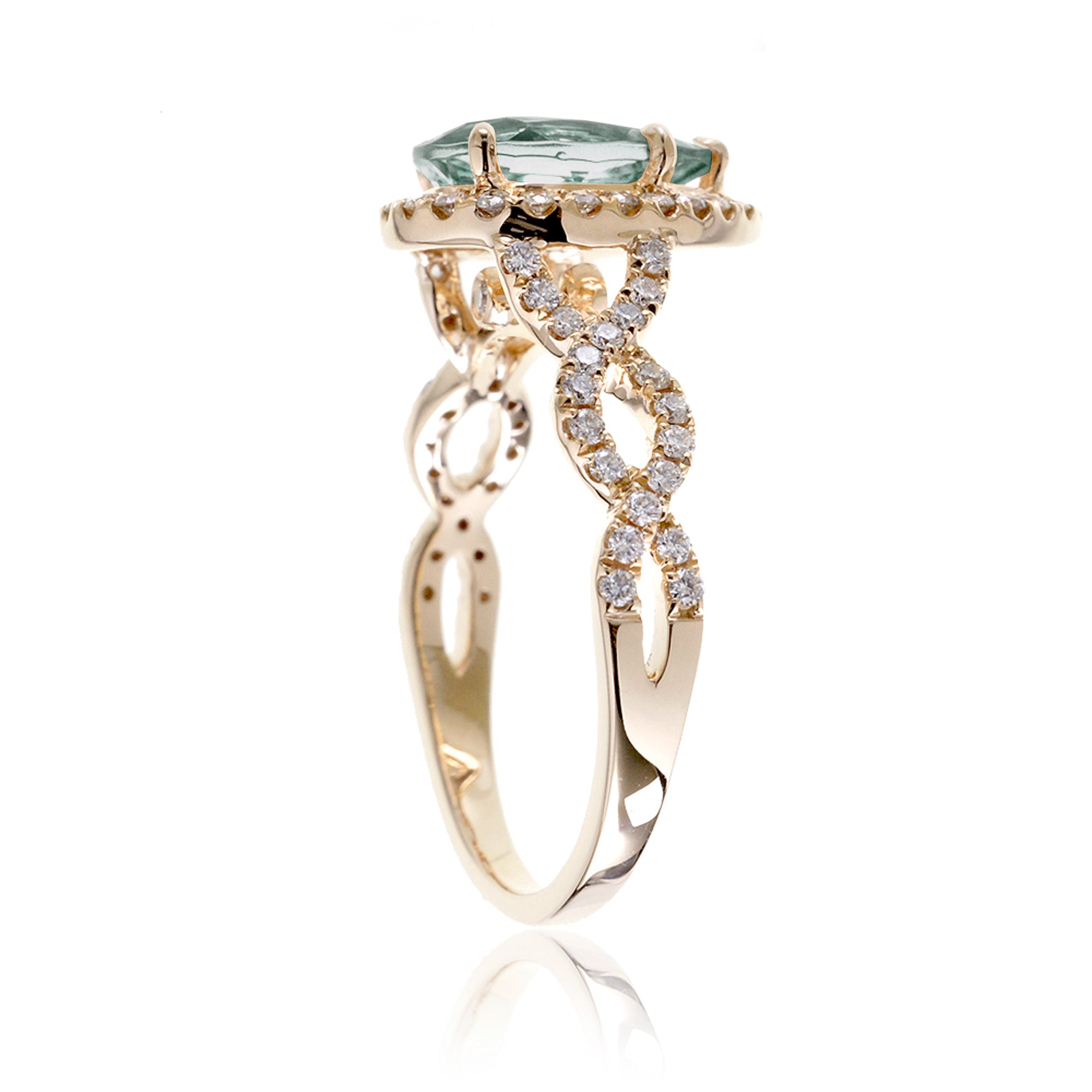 Twist band diamond halo ring with pear green sapphire yellow gold