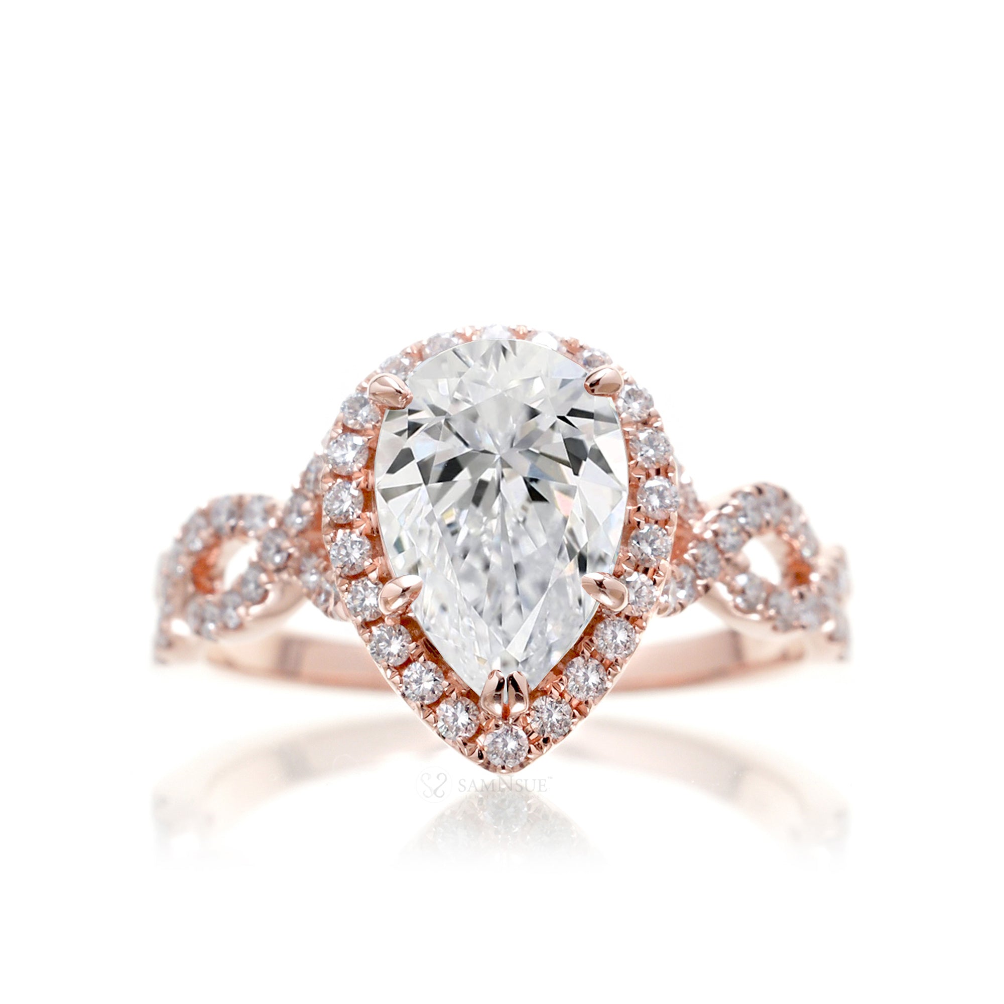 Pear diamond engagement ring halo and twist band rose gold