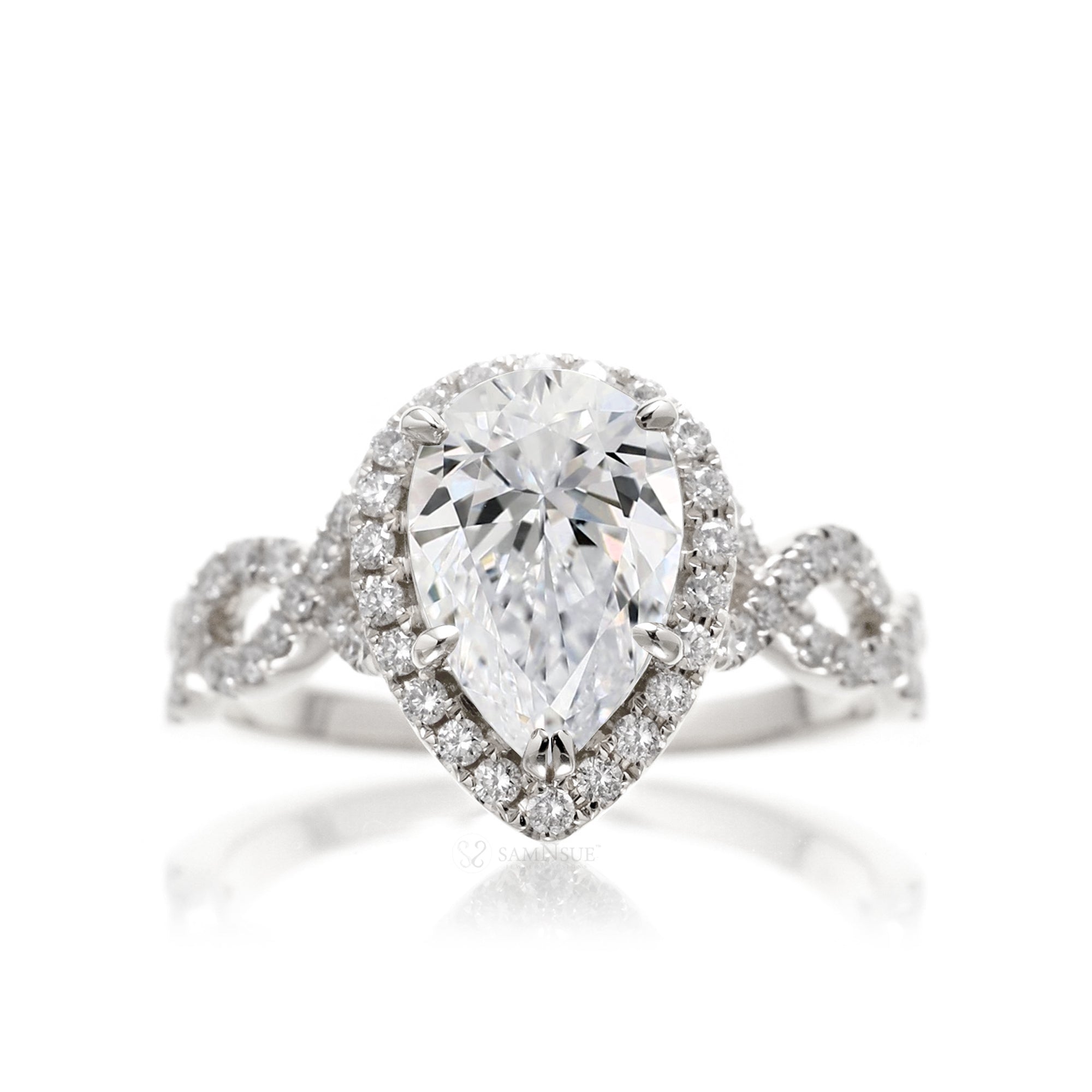 Pear diamond engagement ring halo and twist band white gold
