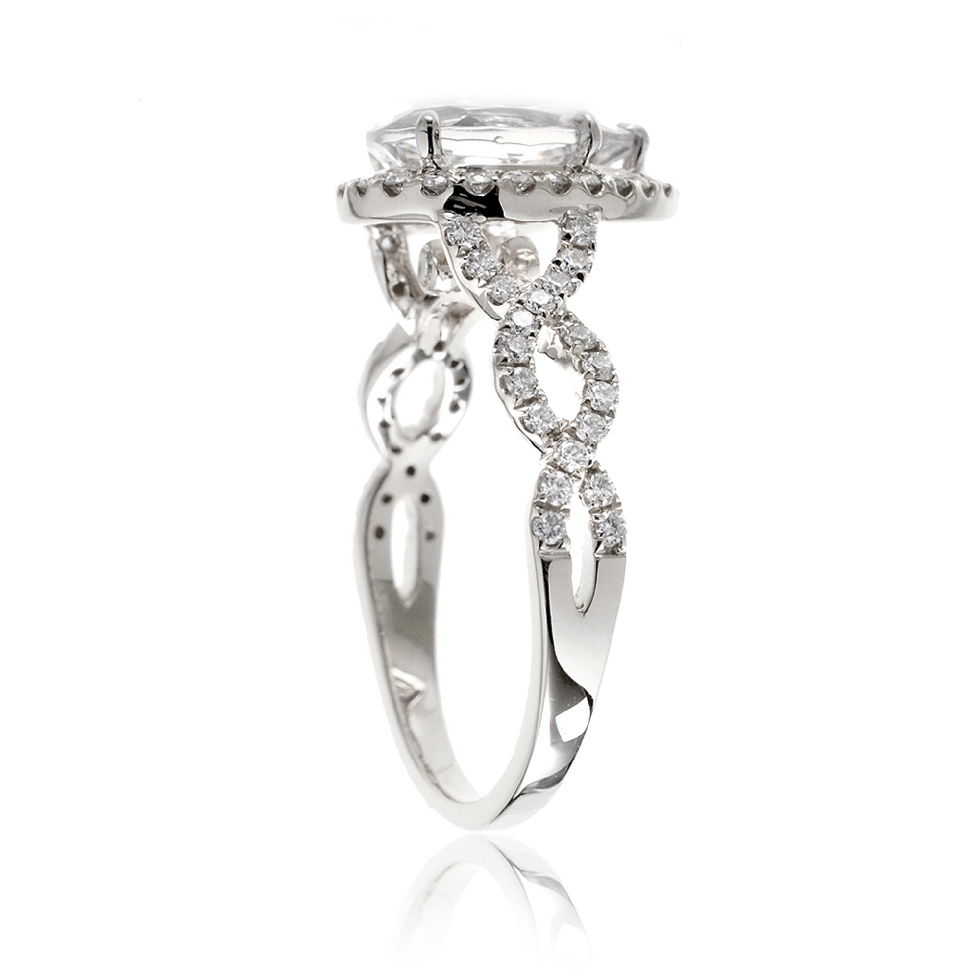 Pear diamond engagement ring halo and twist band white gold