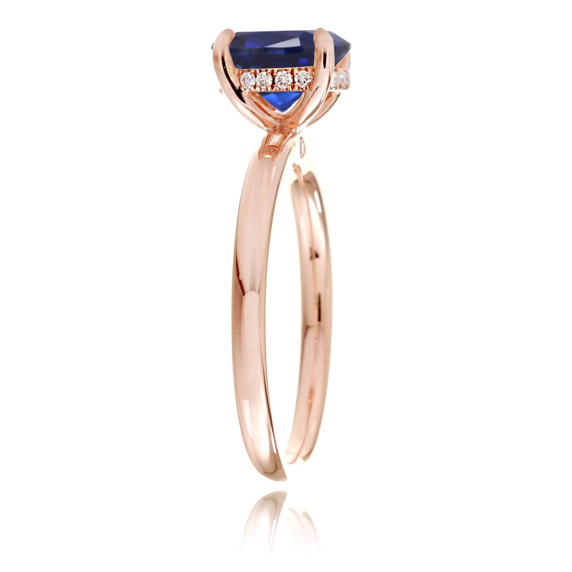 Round cut blue lab-grown sapphire with diamond hidden halo on rose gold