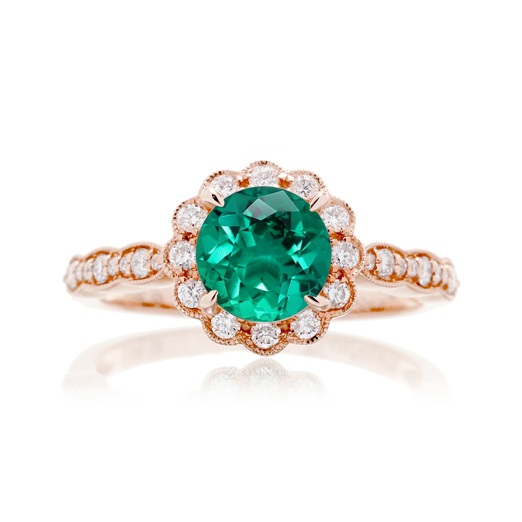 Round emerald engagement ring with scallop halo in rose gold