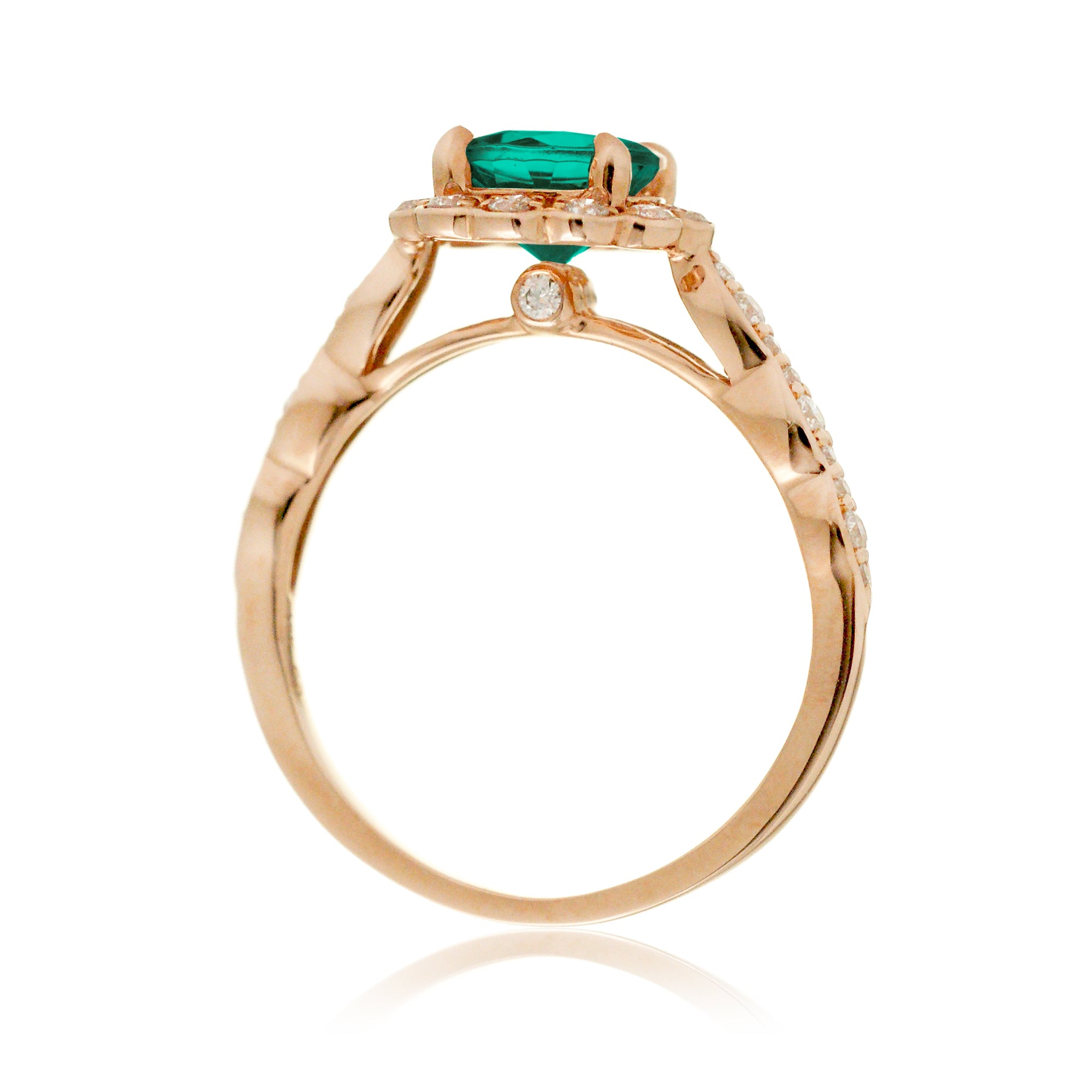 Round emerald engagement ring with scallop halo in rose gold