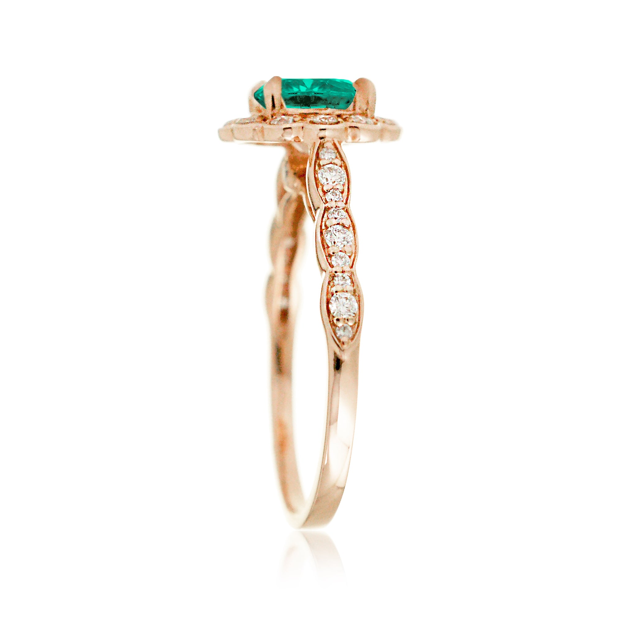 Round emerald engagement ring with scallop halo in rose gold
