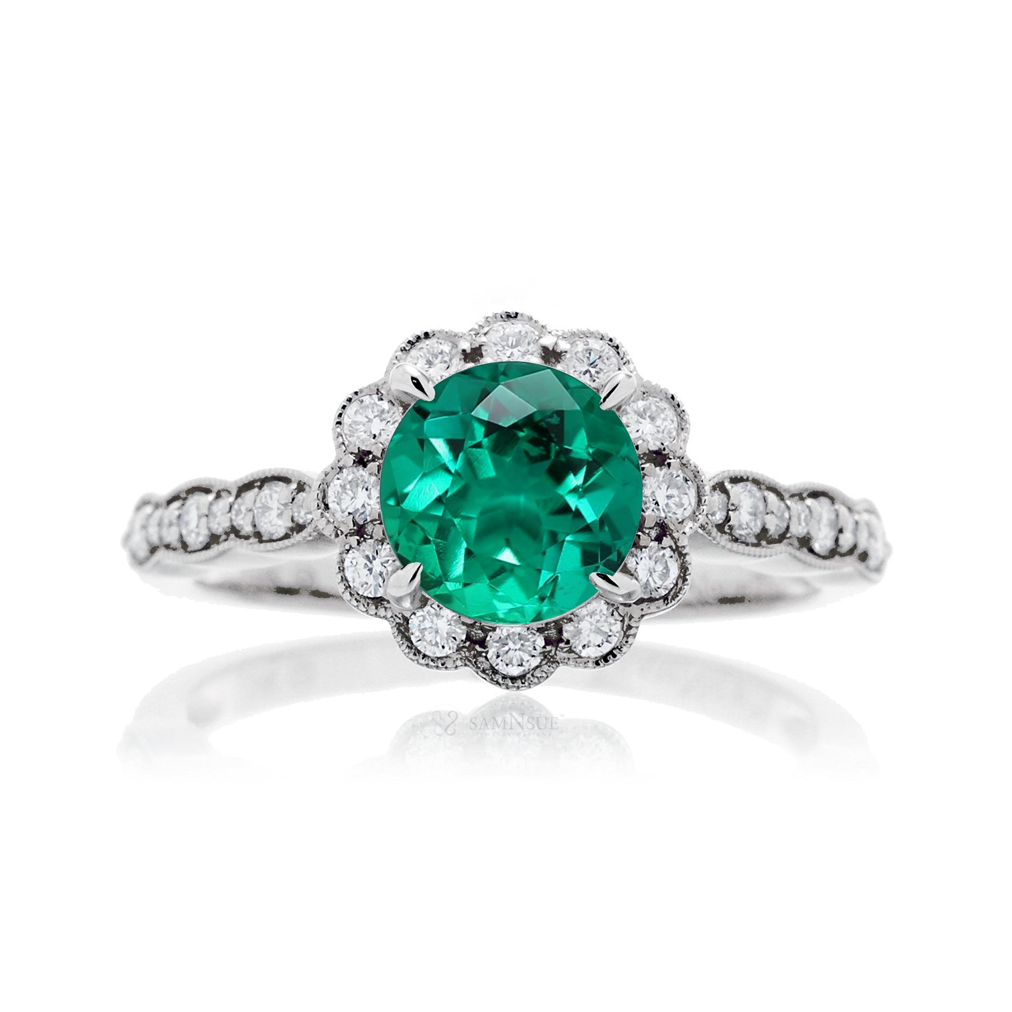 Round emerald engagement ring with scallop halo in white gold