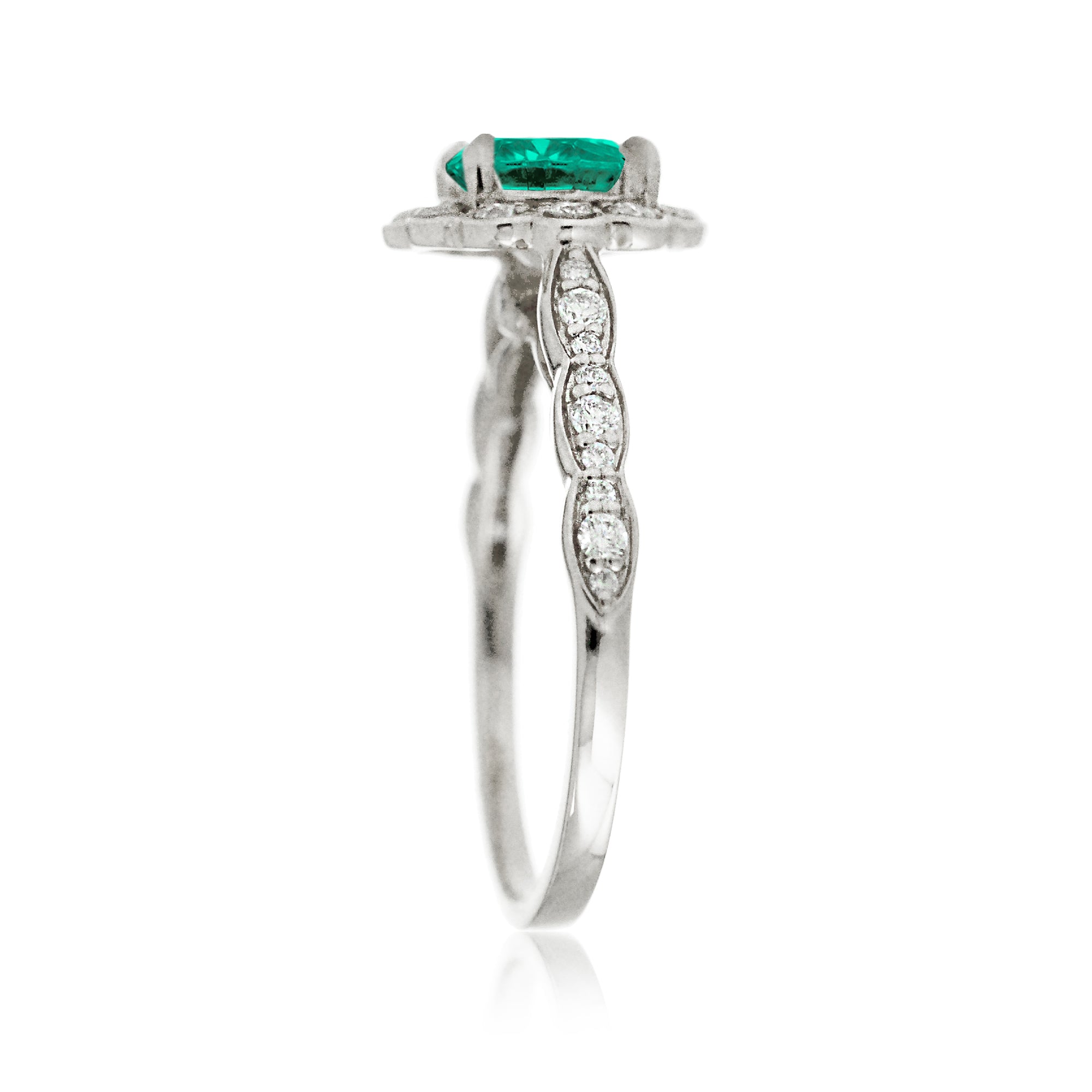 Round emerald engagement ring with scallop halo in white gold