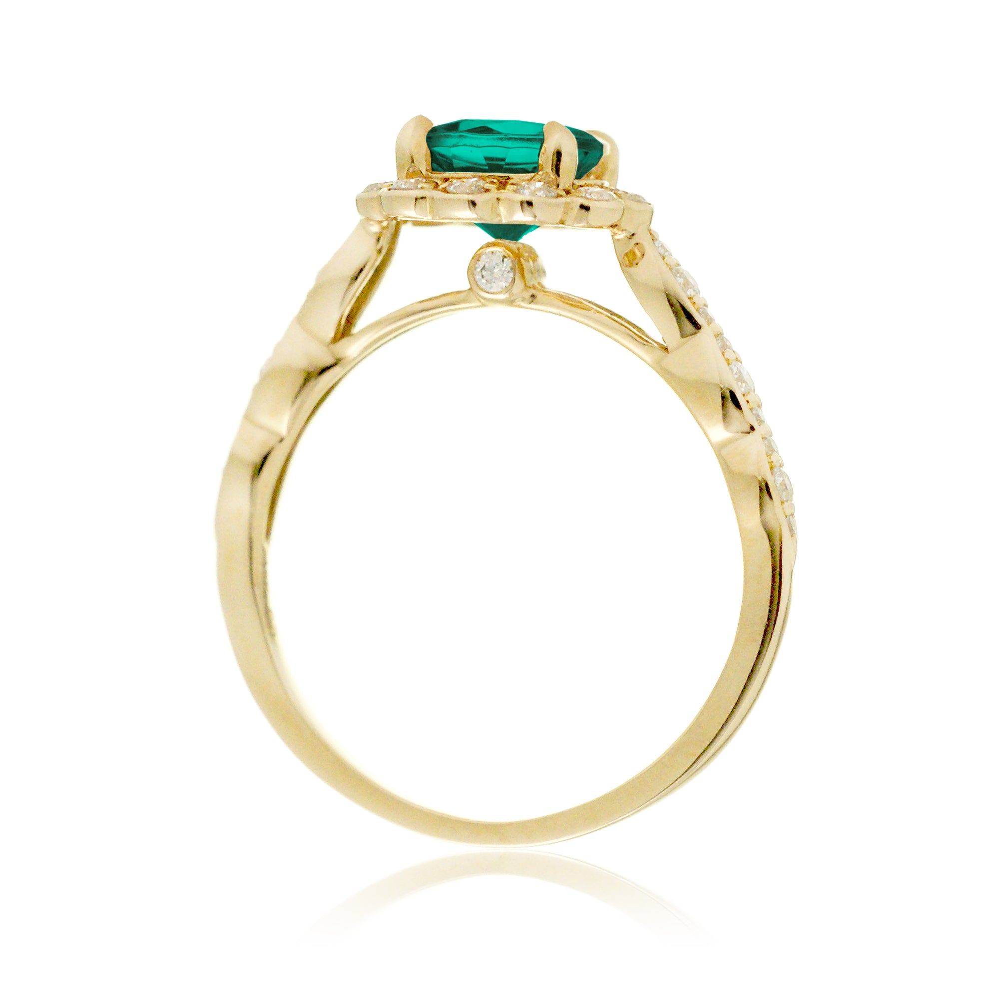 Round emerald engagement ring with scallop halo in yellow gold