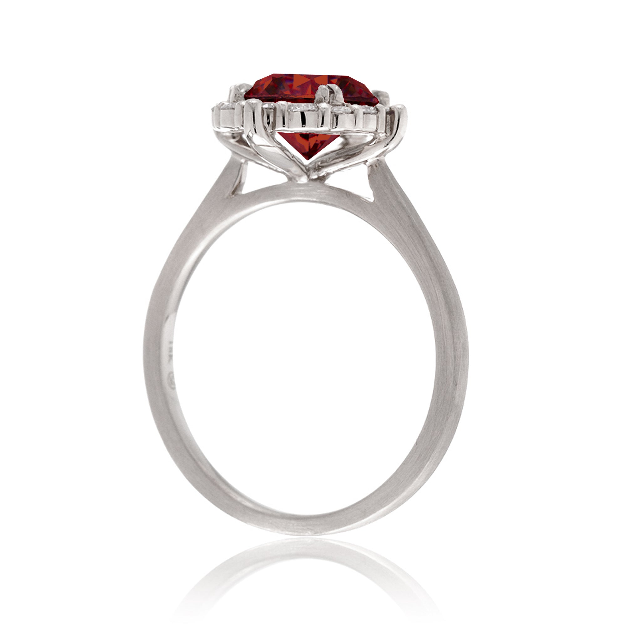 Round cut ruby diamond halo engagement ring with a solid white gold band
