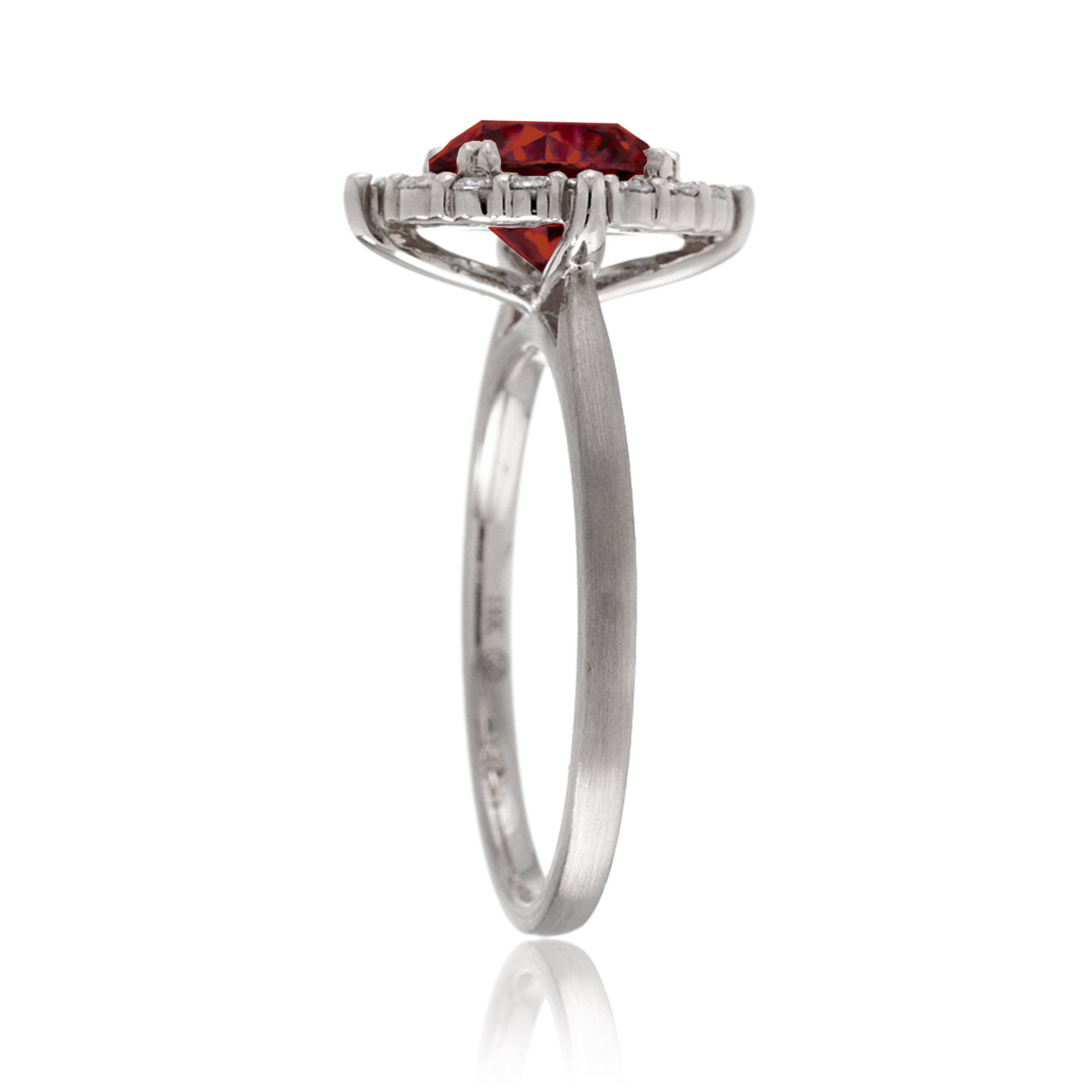 Round cut ruby diamond halo engagement ring with a solid white gold band