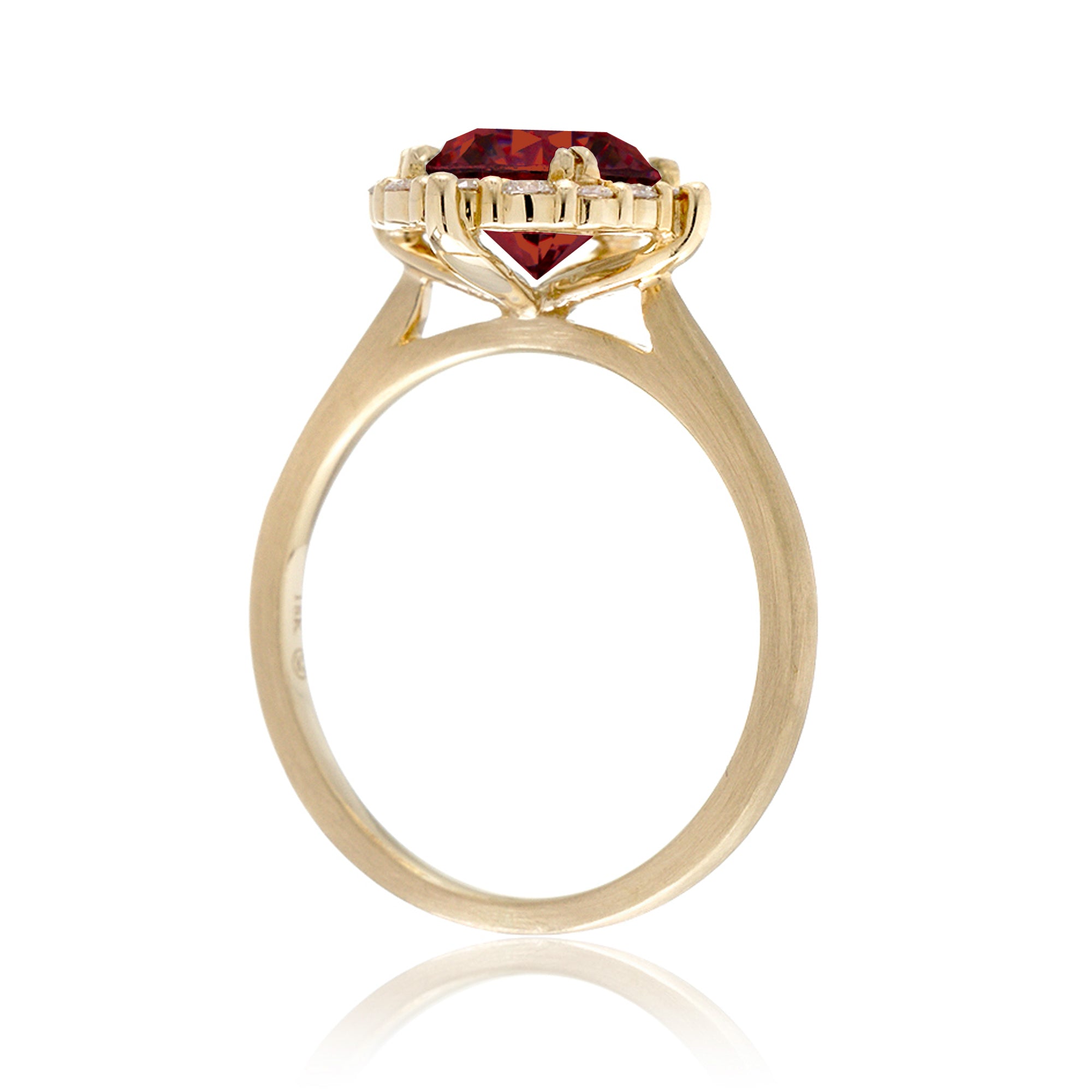 Round cut ruby diamond halo engagement ring with a solid yellow gold band