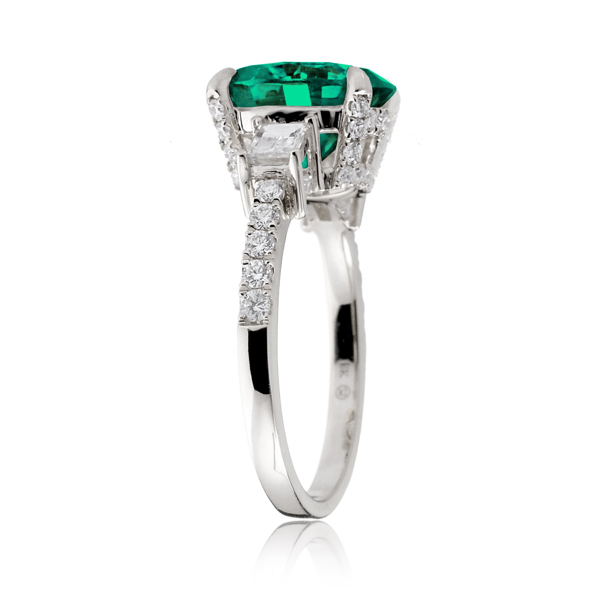 Green emerald three stone diamond baguette engagement ring white gold