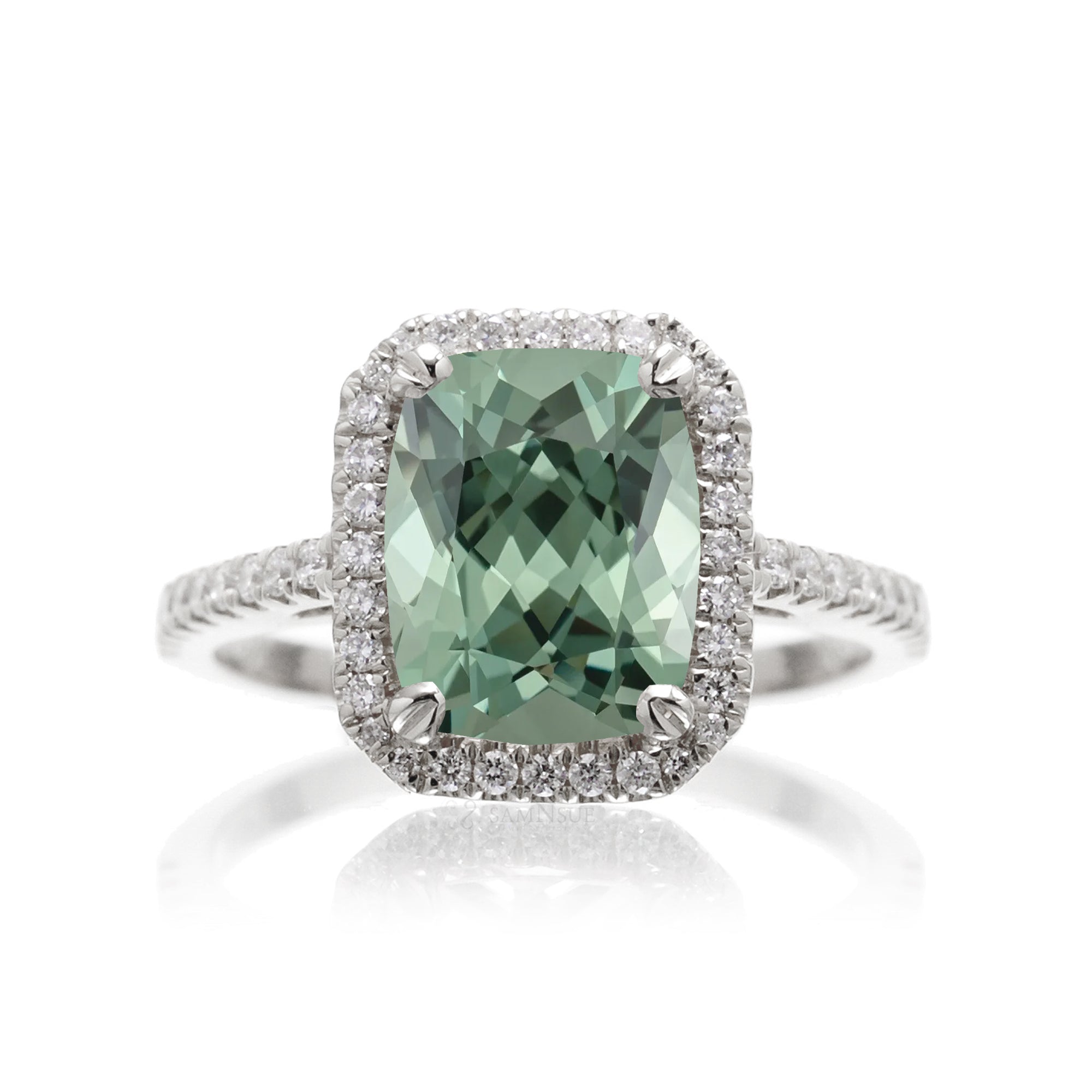 Cushion cut green sapphire engagement ring The signature diamond halo in white gold