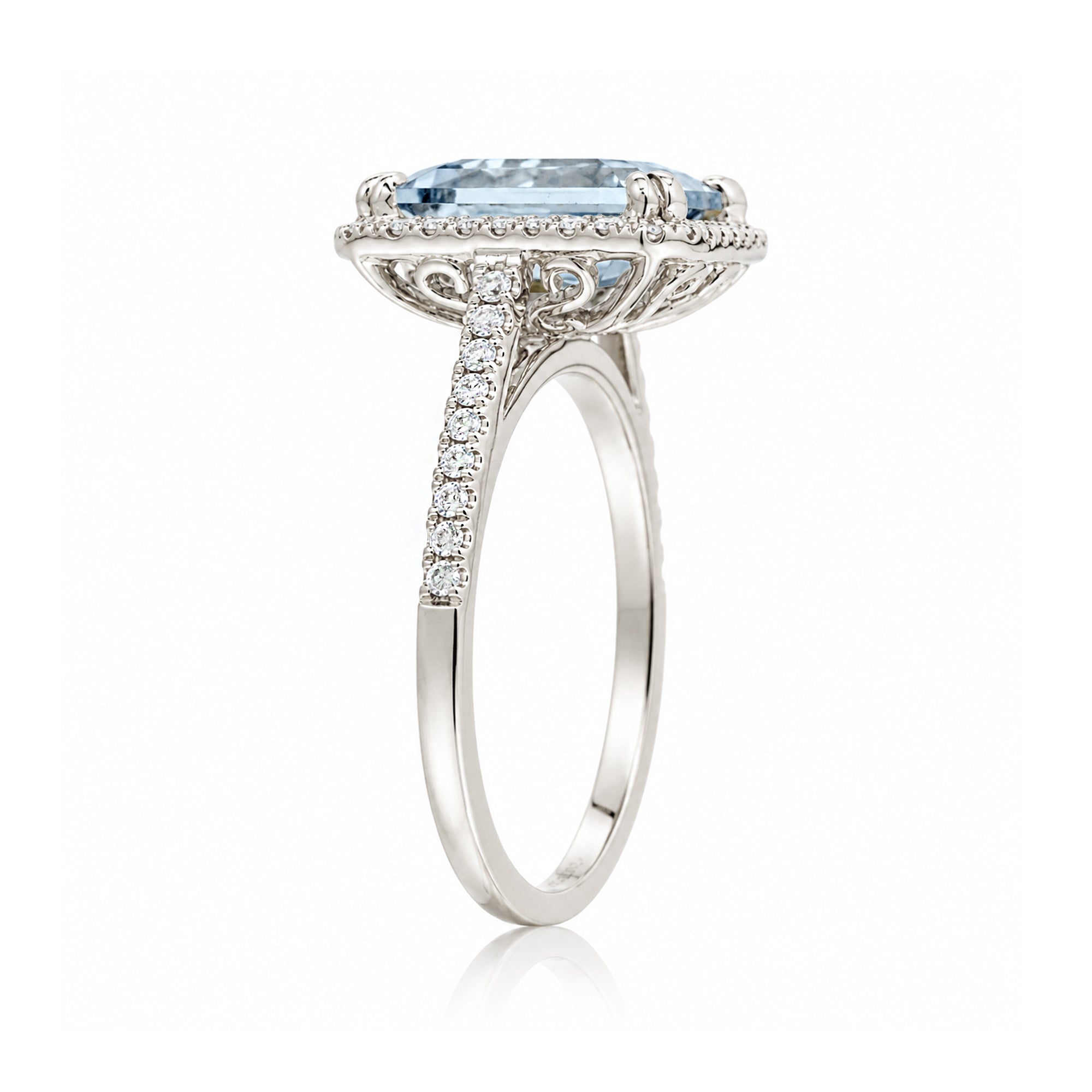 Emerald cut aquamarine diamond halo and square band cathedral setting white gold