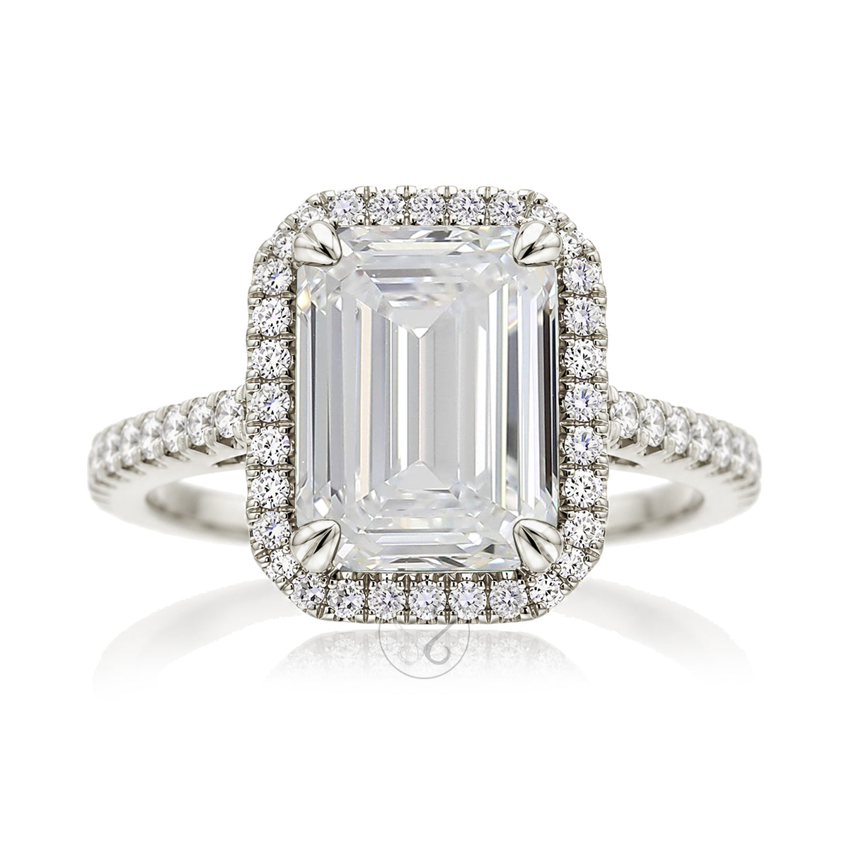 Emerald step cut diamond halo ring with a squarish band and cathedral setting white gold