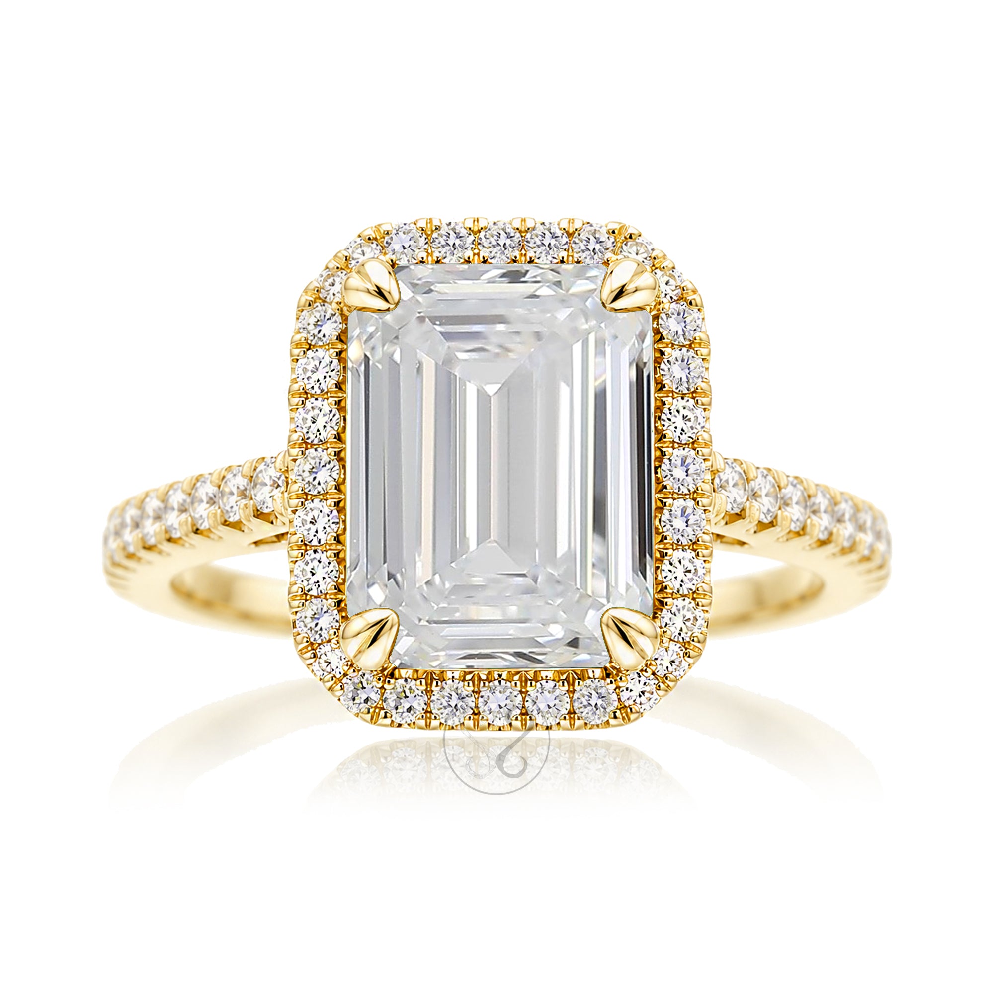 Emerald step cut diamond halo ring with a squarish band and cathedral setting yellow gold