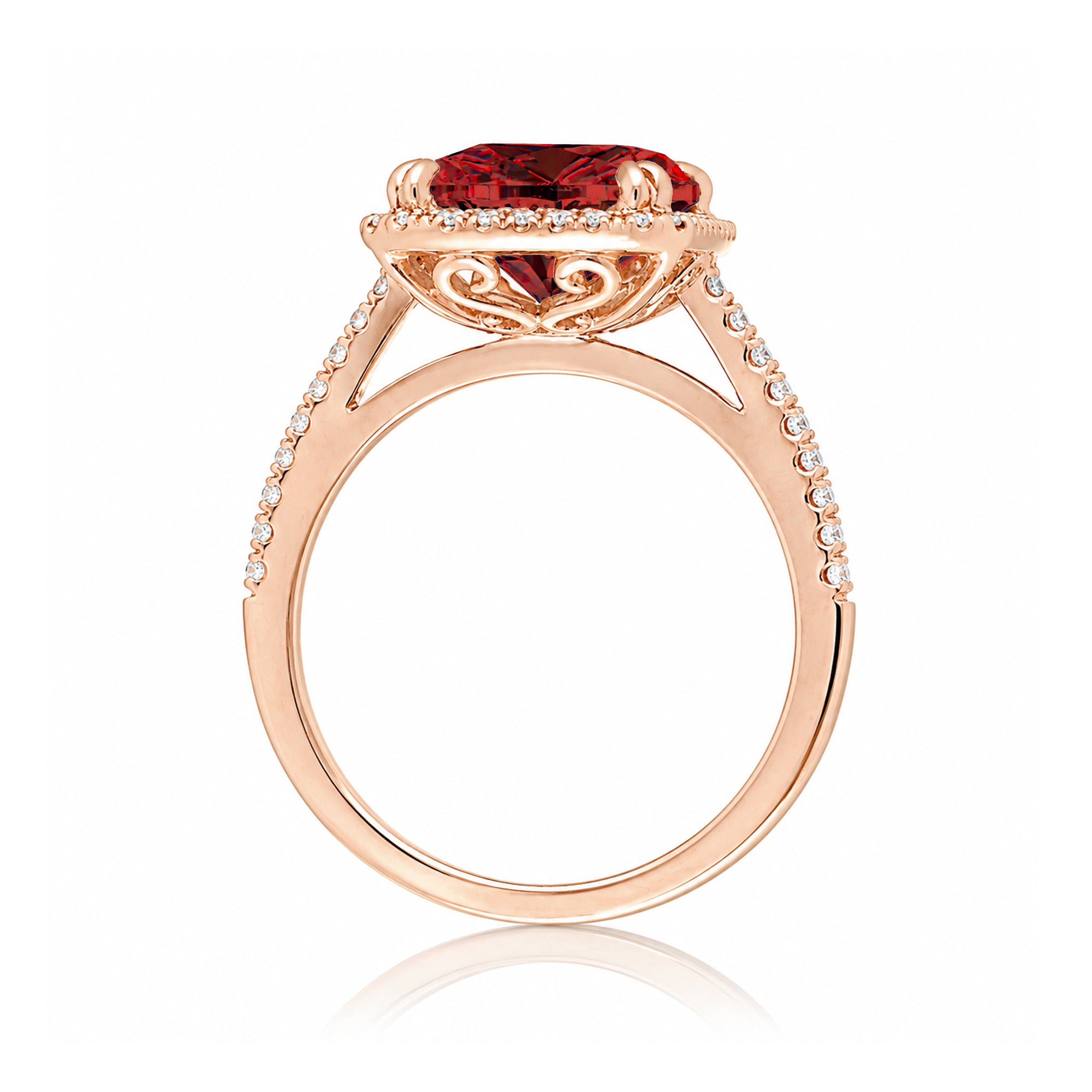Emerald step cut ruby halo ring with a squarish band and cathedral setting rose gold