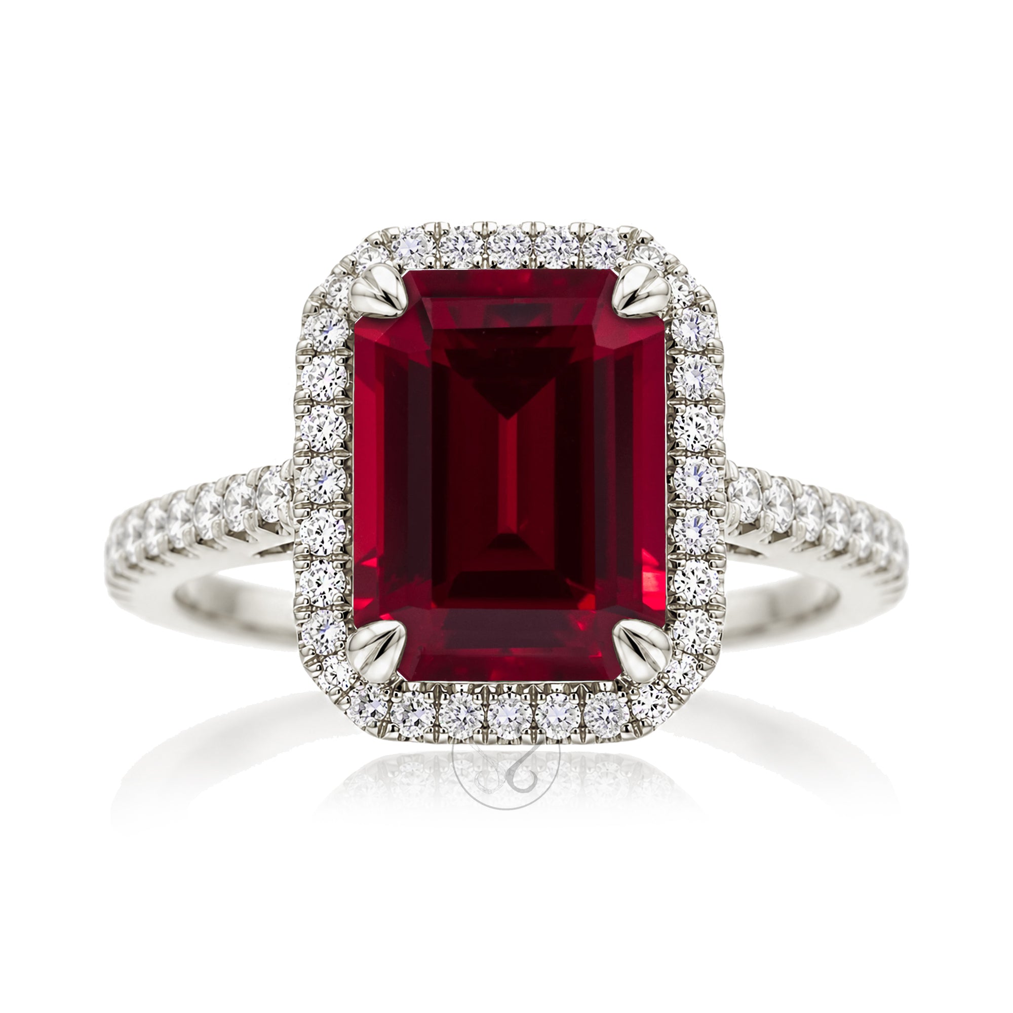 Emerald step cut ruby halo ring with a squarish band and cathedral setting white gold