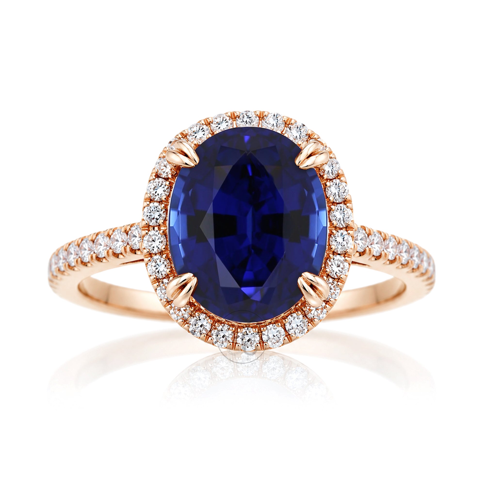 Oval blue sapphire engagement ring with diamond halo and square diamond band on a cathedral rose gold setting