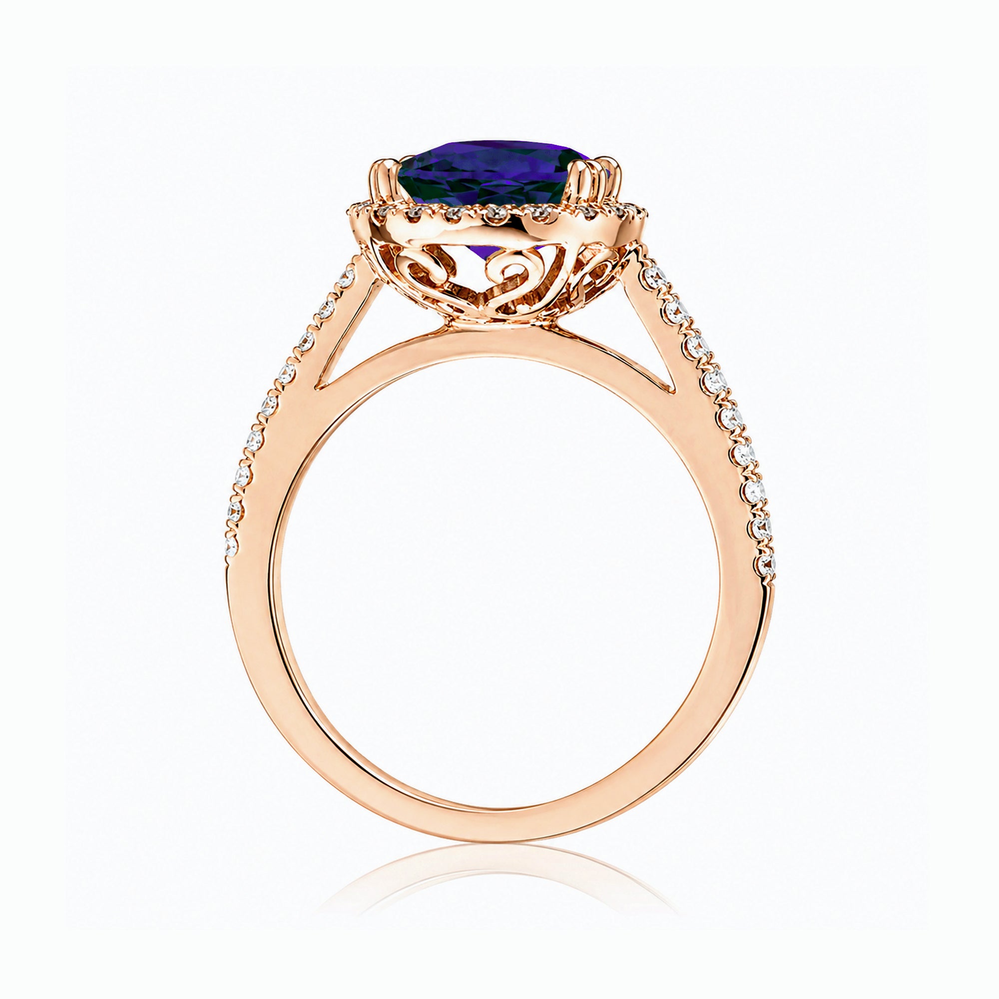 Oval blue sapphire engagement ring with diamond halo and square diamond band on a cathedral rose gold setting