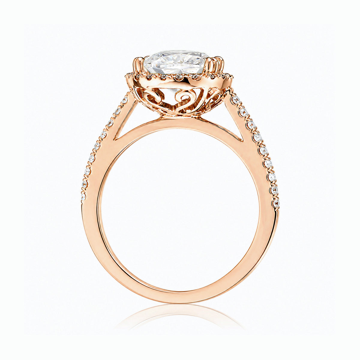 Oval diamond engagement ring with halo and cathedral setting in rose gold