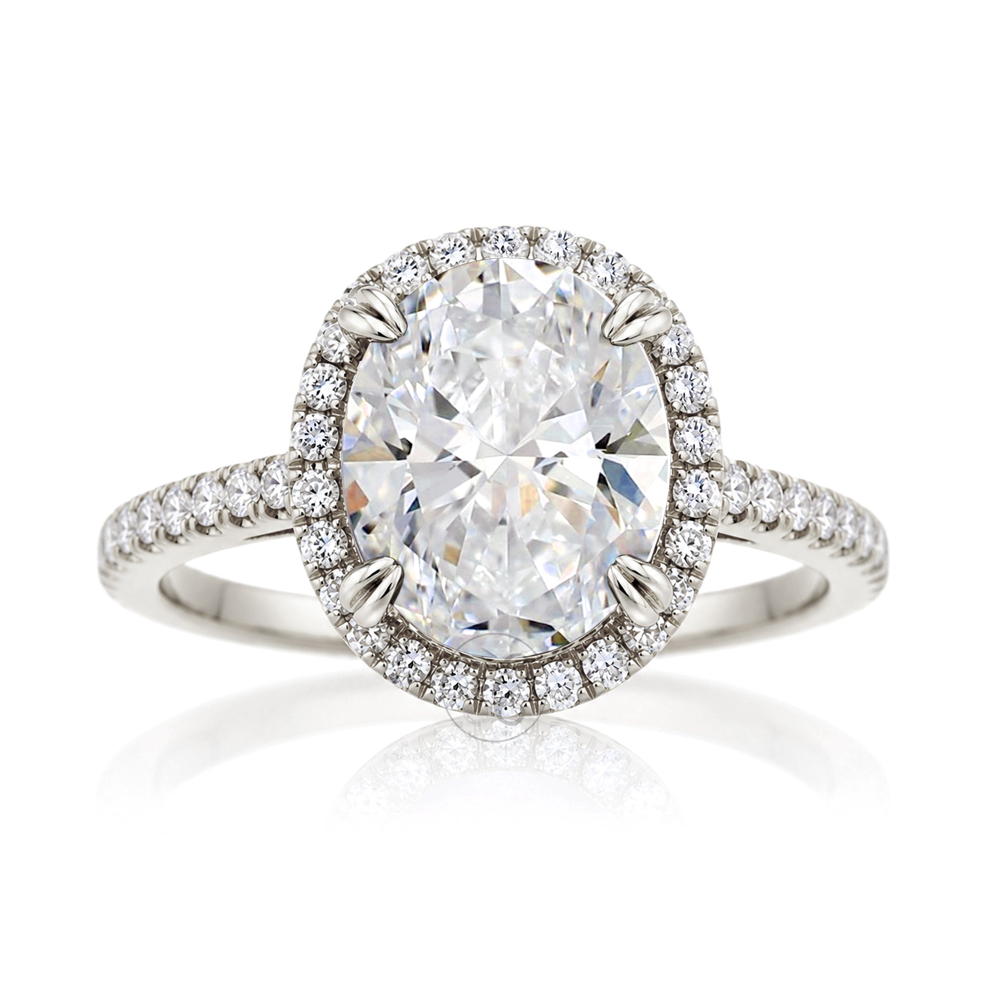 Oval diamond engagement ring with halo and cathedral setting in white gold
