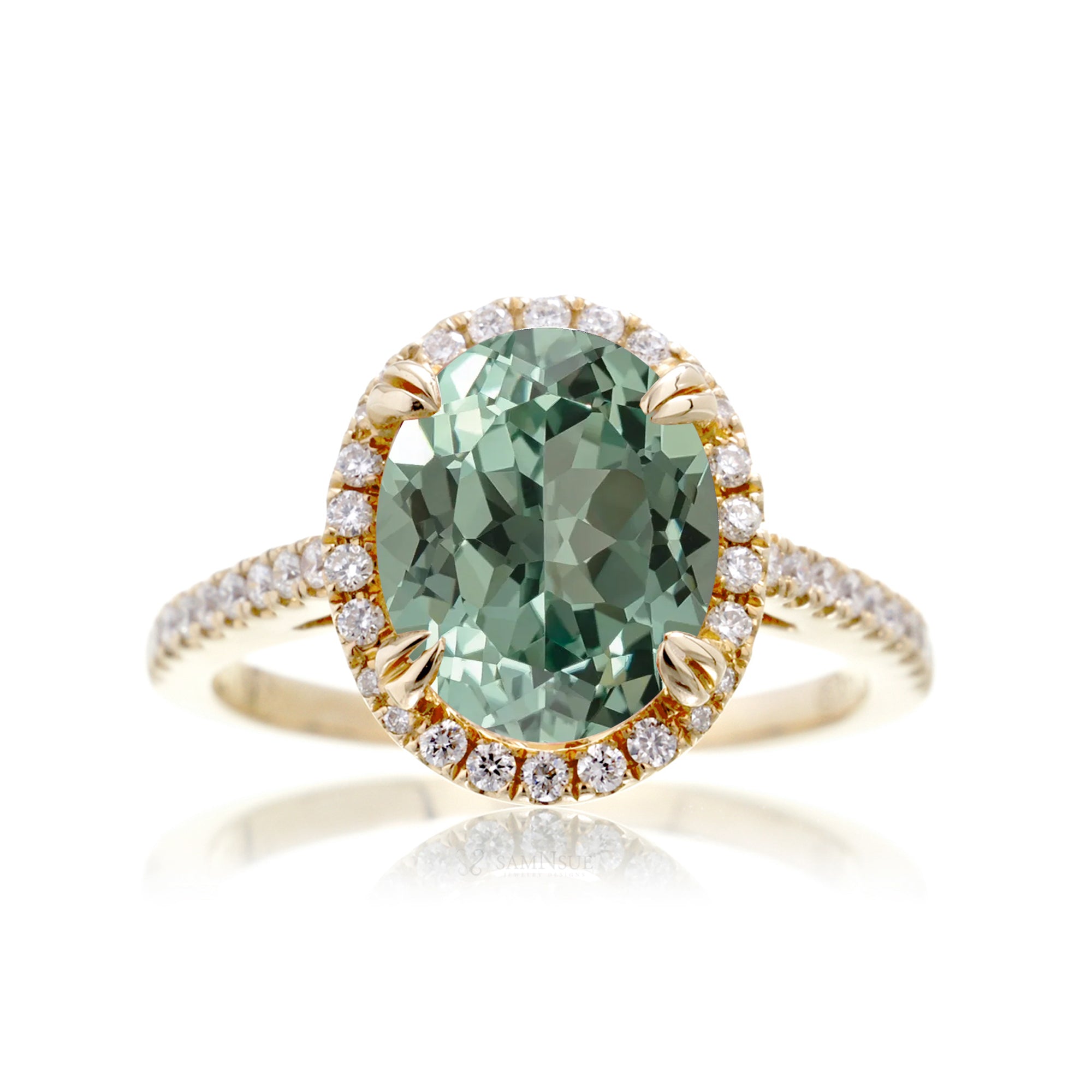 Oval green sapphire engagement ring with diamond halo in yellow gold