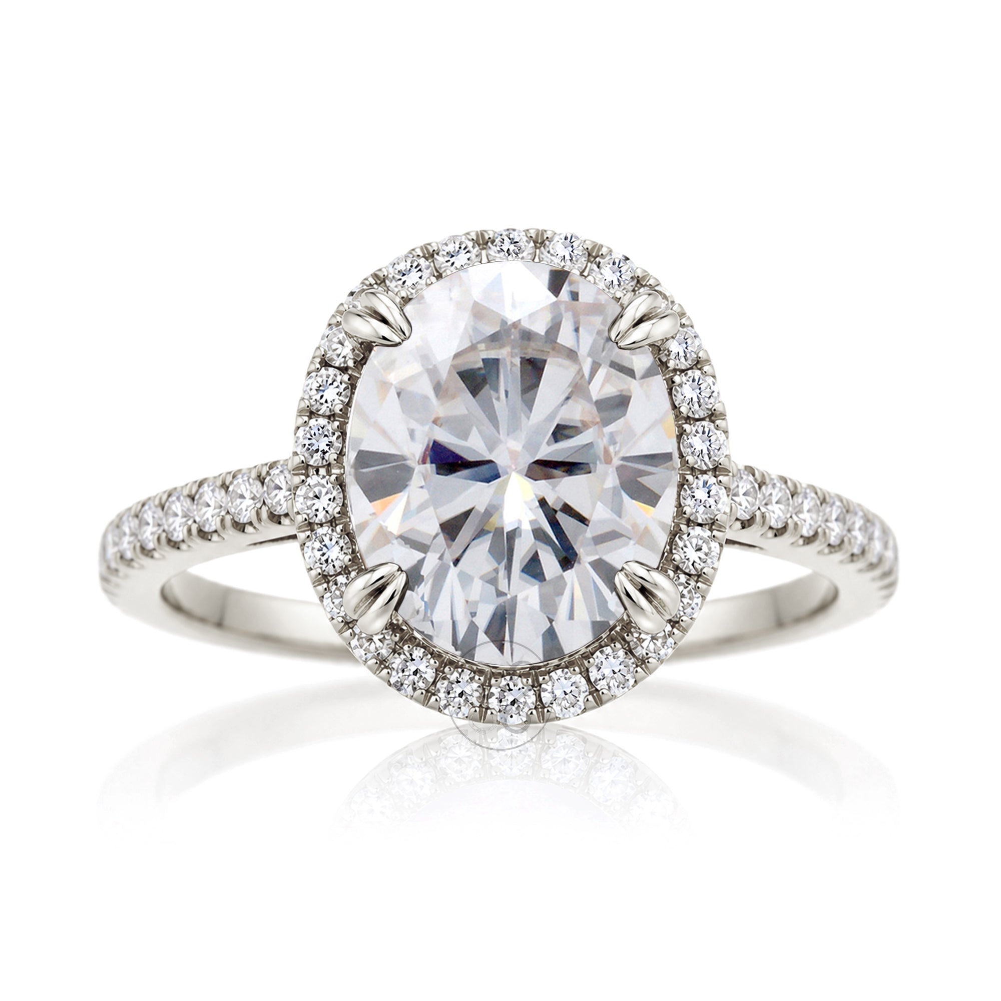 Oval moissanite engagement ring with a diamond halo and squarish diamond band on a cathedral white gold setting