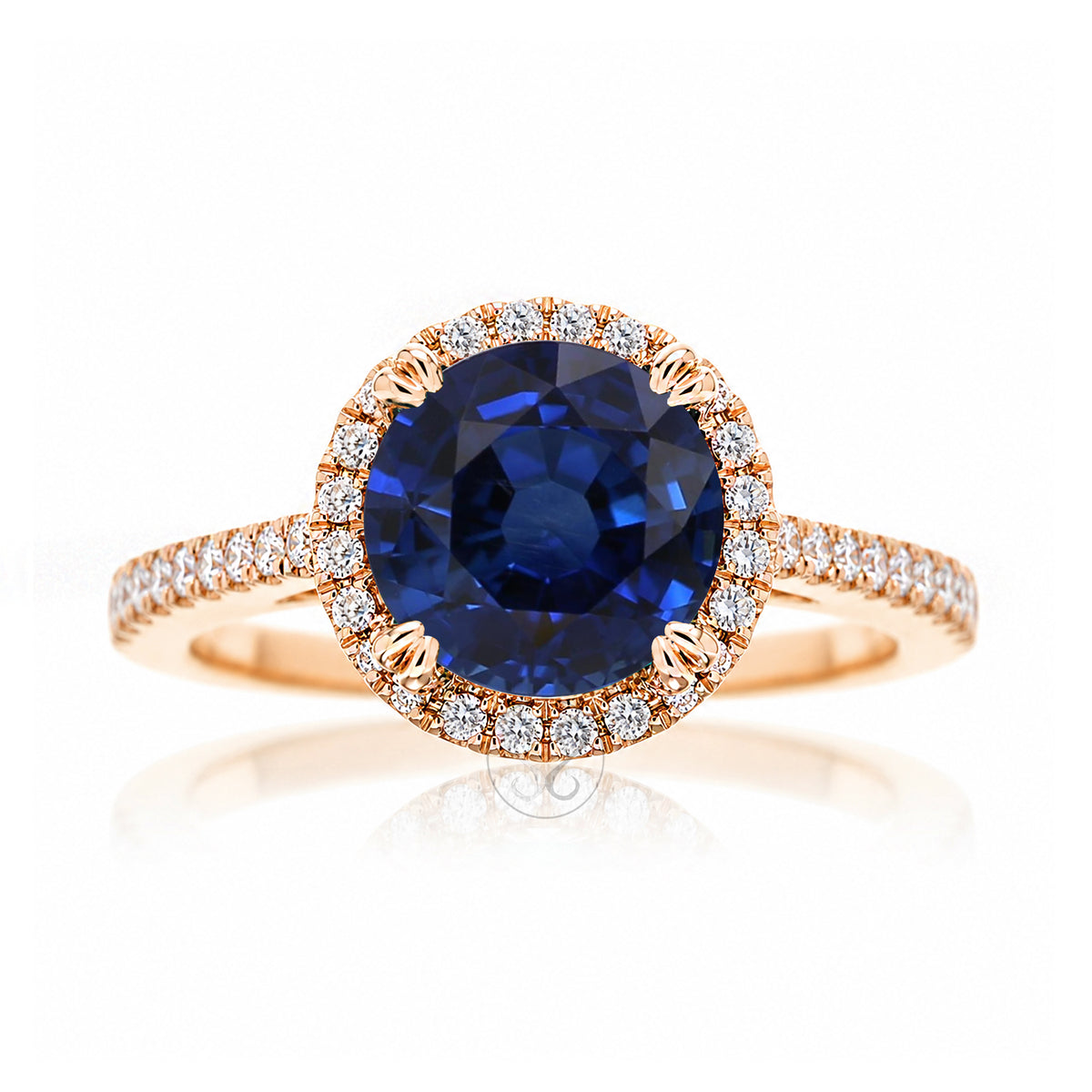 Round blue sapphire diamond halo ring with squarish diamond band rose gold