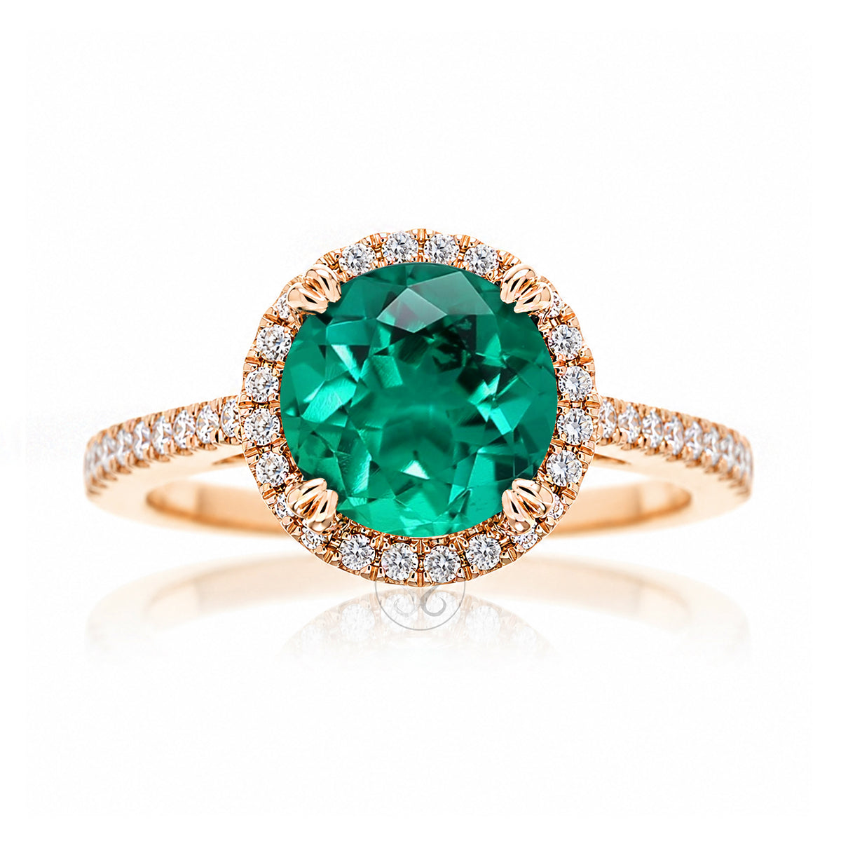 Round emerald diamond halo ring with squarish diamond band rose gold