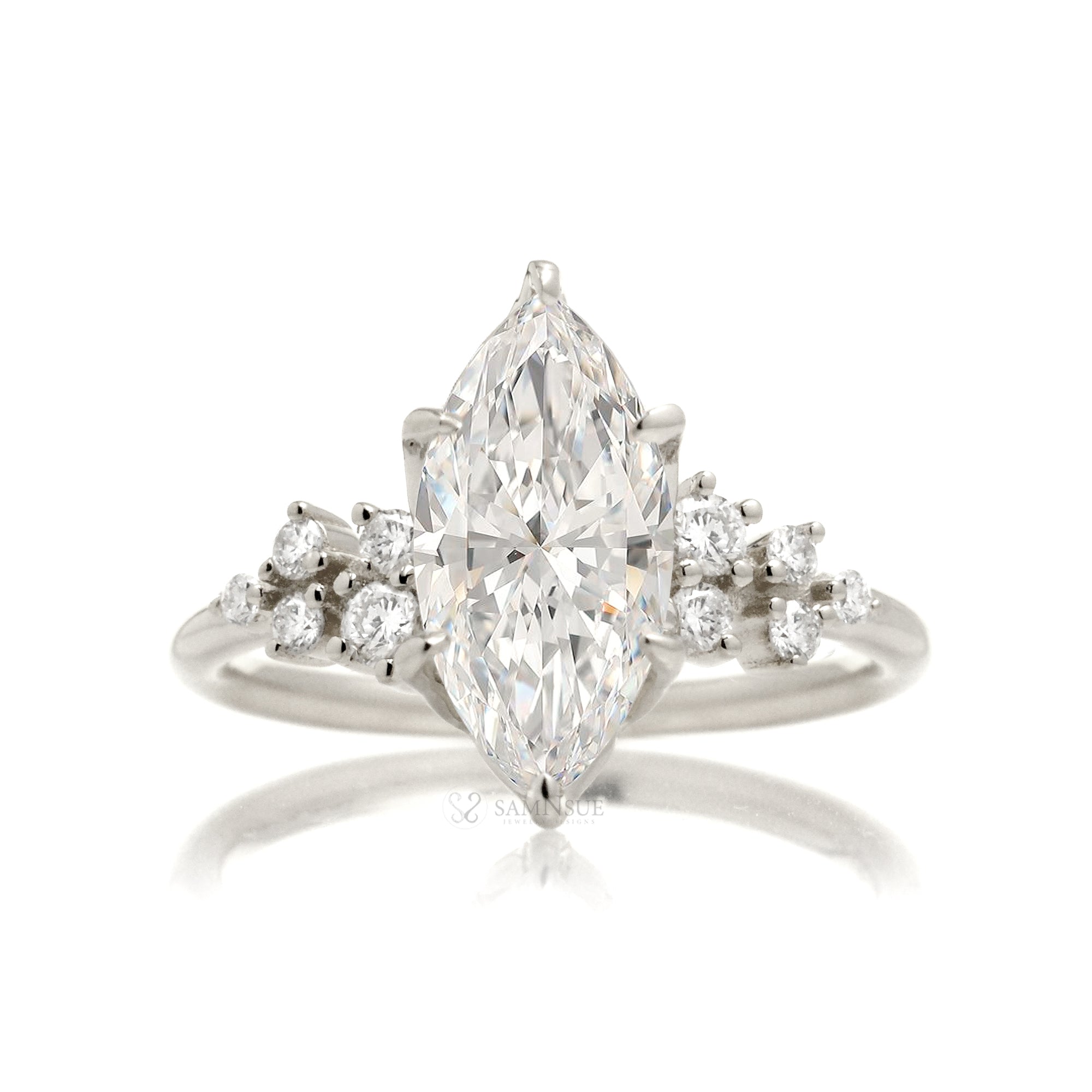 Marquise cut diamond solitaire with accent side constellation diamond in white gold