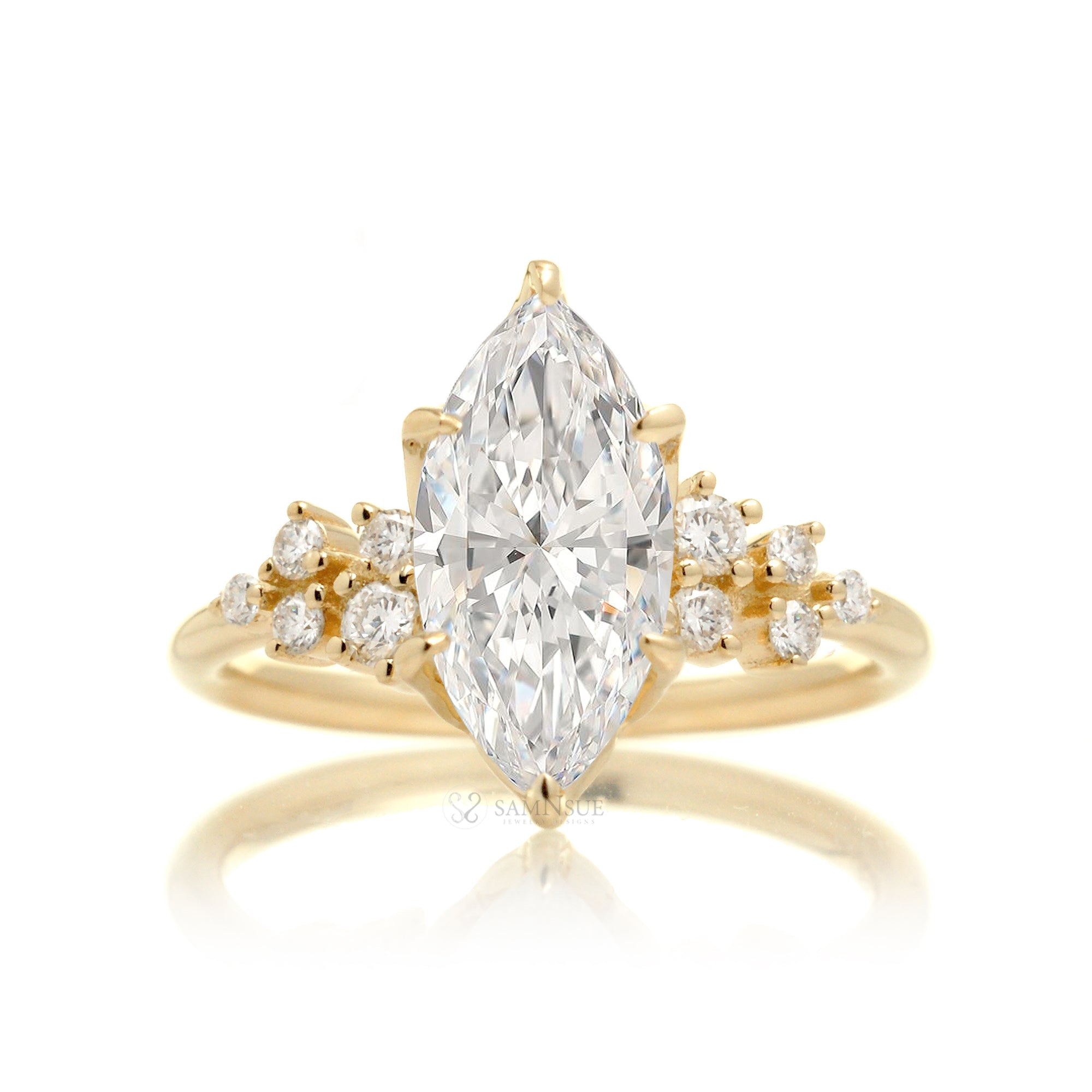 Marquise cut diamond solitaire with accent side constellation diamond in yellow gold