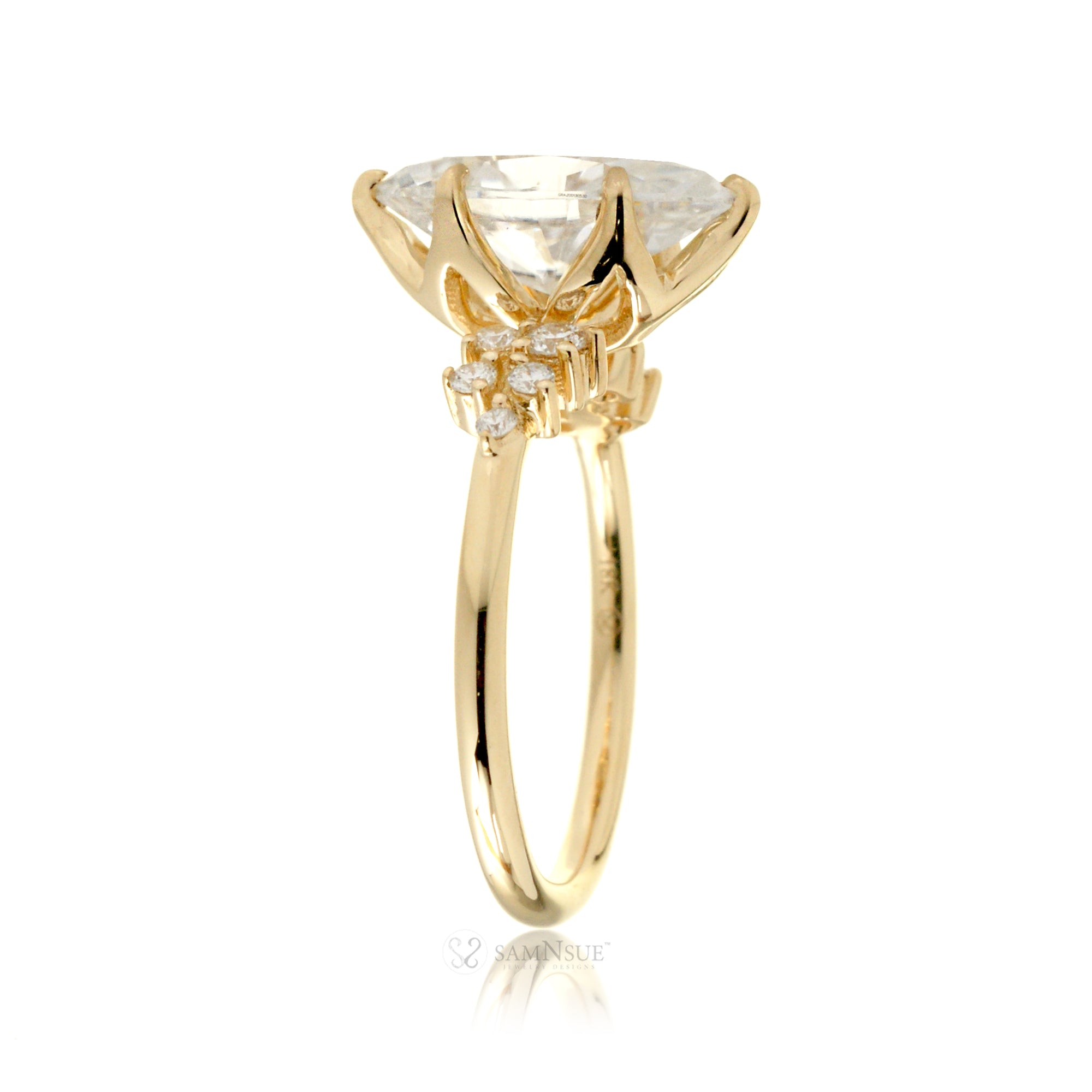 Marquise cut moissanite crown basket and diamond side stone ring yellow gold