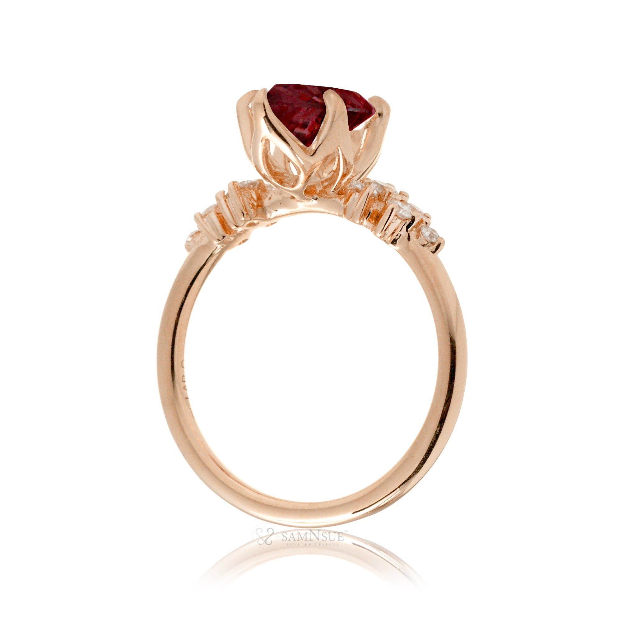 Marquise ruby and diamond solitaire engagement ring in rose gold