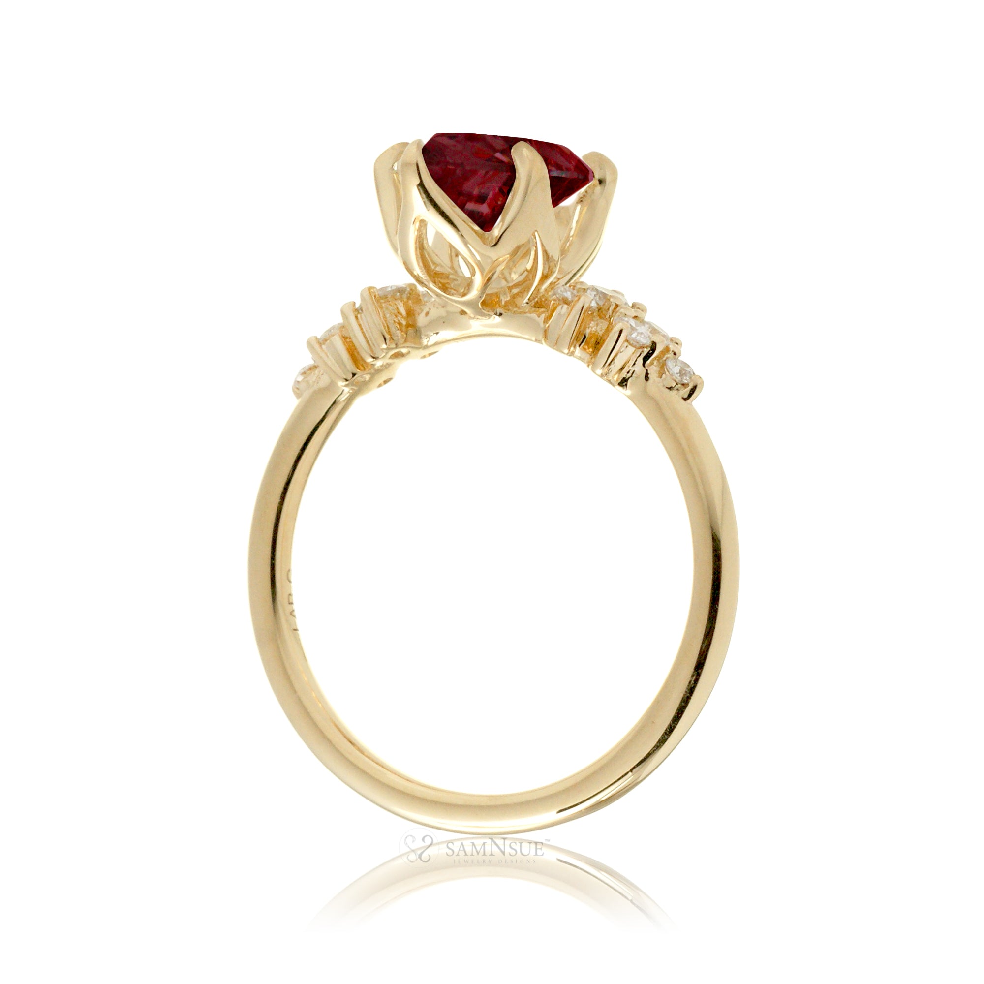 Marquise ruby and diamond solitaire engagement ring in yellow gold