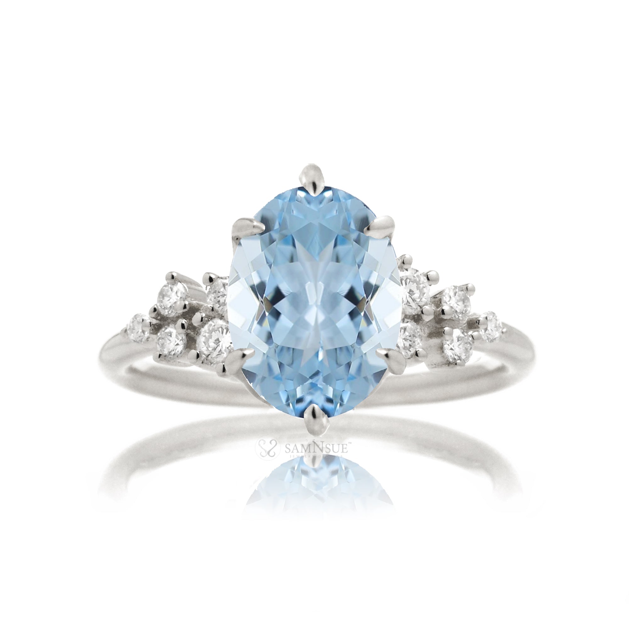 Aquamarine ring with oval center stone and side accent diamonds in white gold