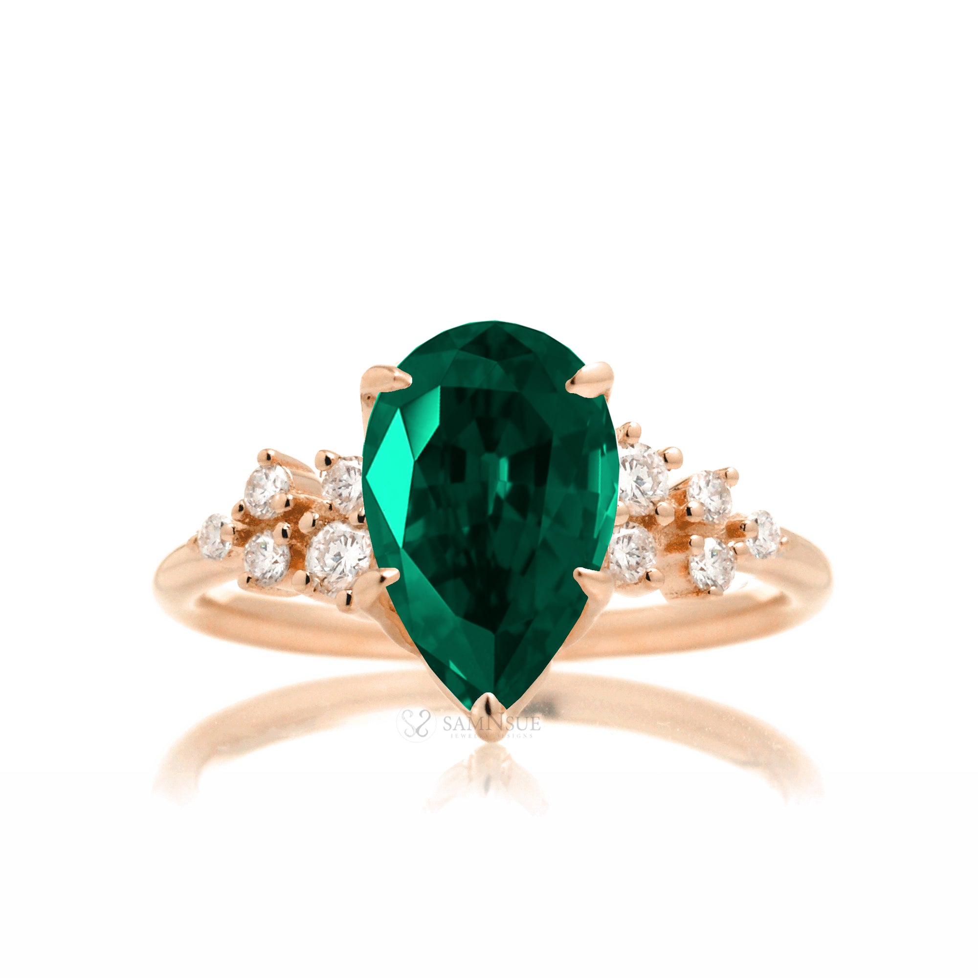 Pear green emerald and diamond three stone ring rose gold