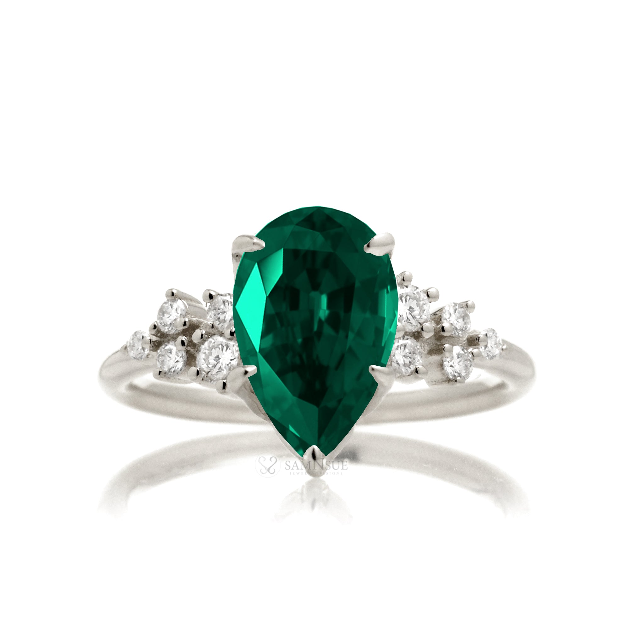 Pear green emerald and diamond three stone ring white gold