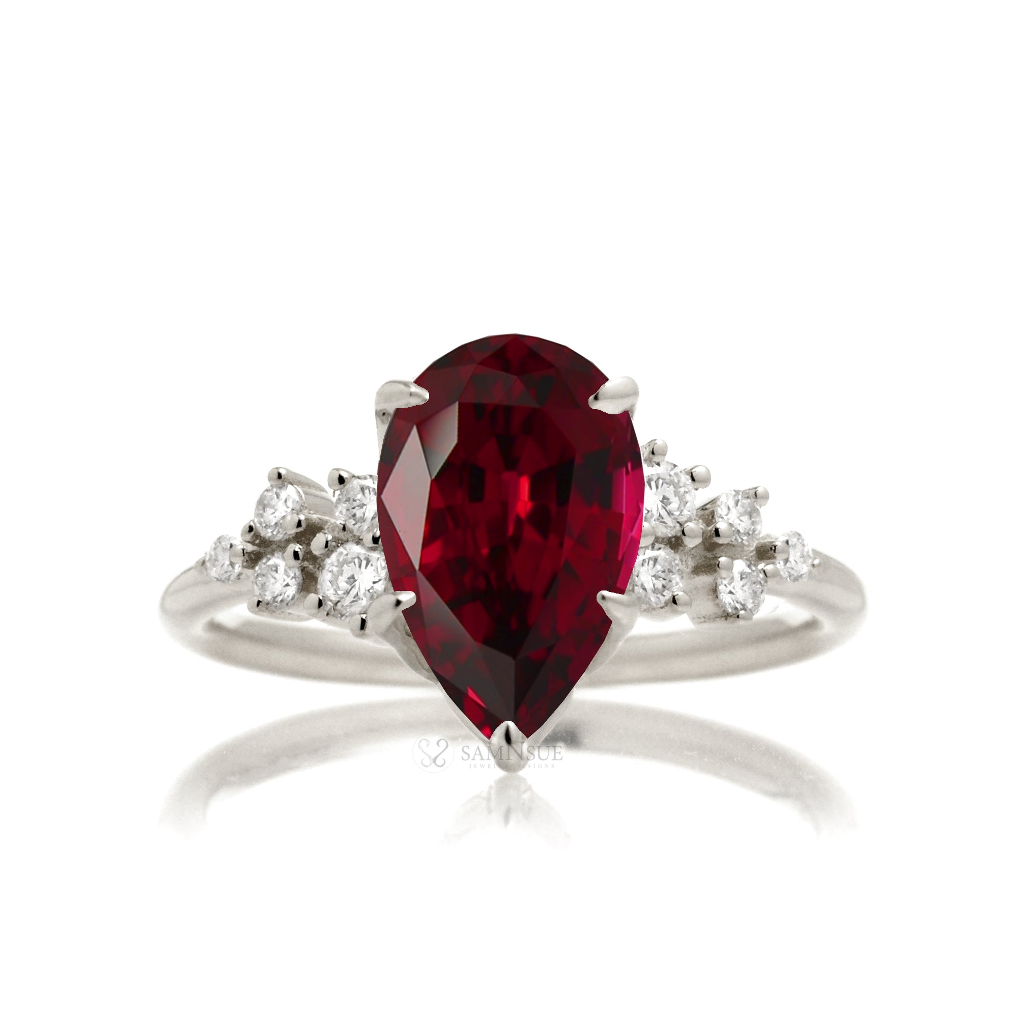 Pear ruby and diamond three stone ring white gold