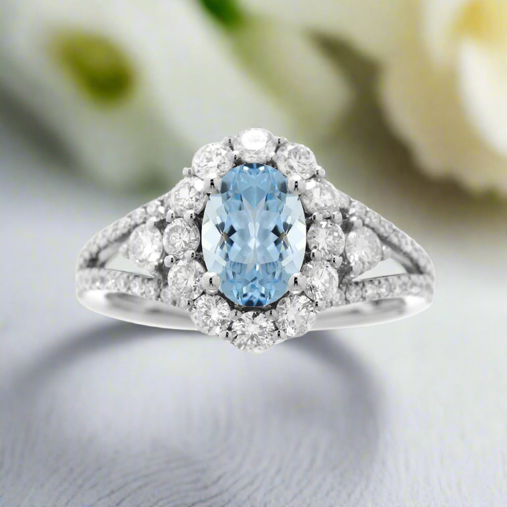 Oval cut aquamarine diamond halo split band three stone ring white gold