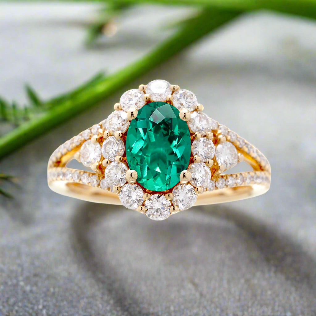 Oval cut green emerald ring with halo split band and three stone design ring yellow gold