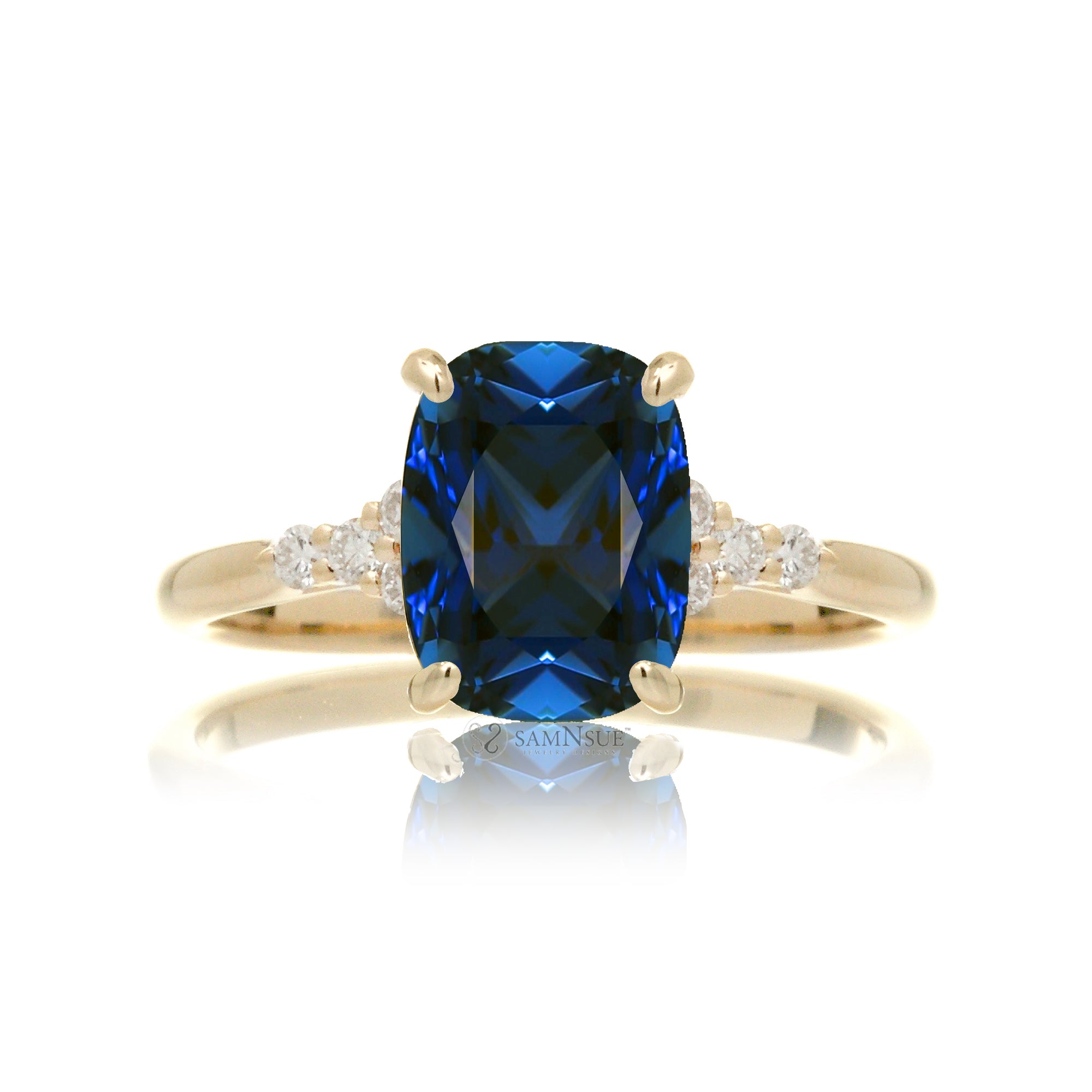 Cushion cut diamond three stone ring yellow gold