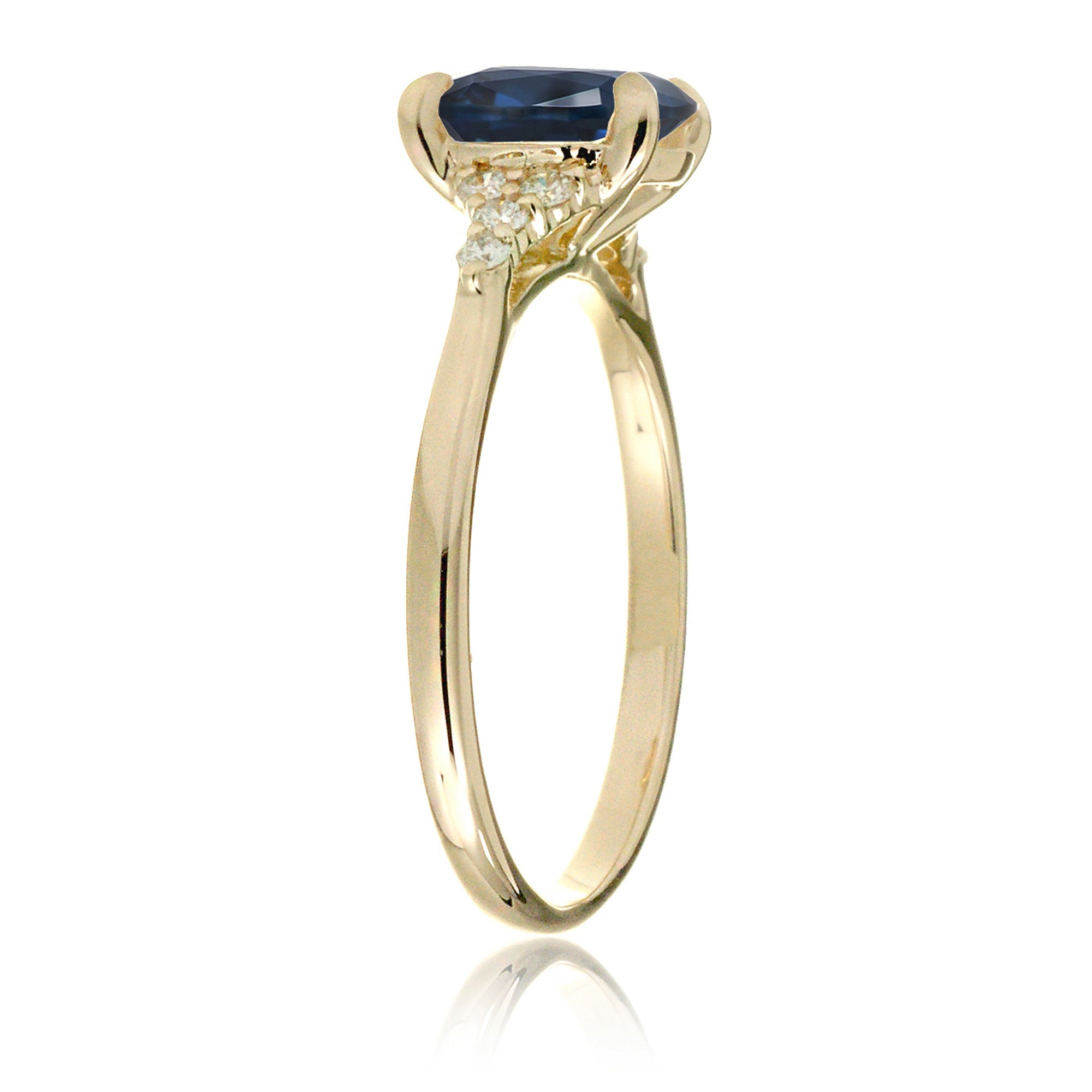 Cushion cut diamond three stone ring yellow gold