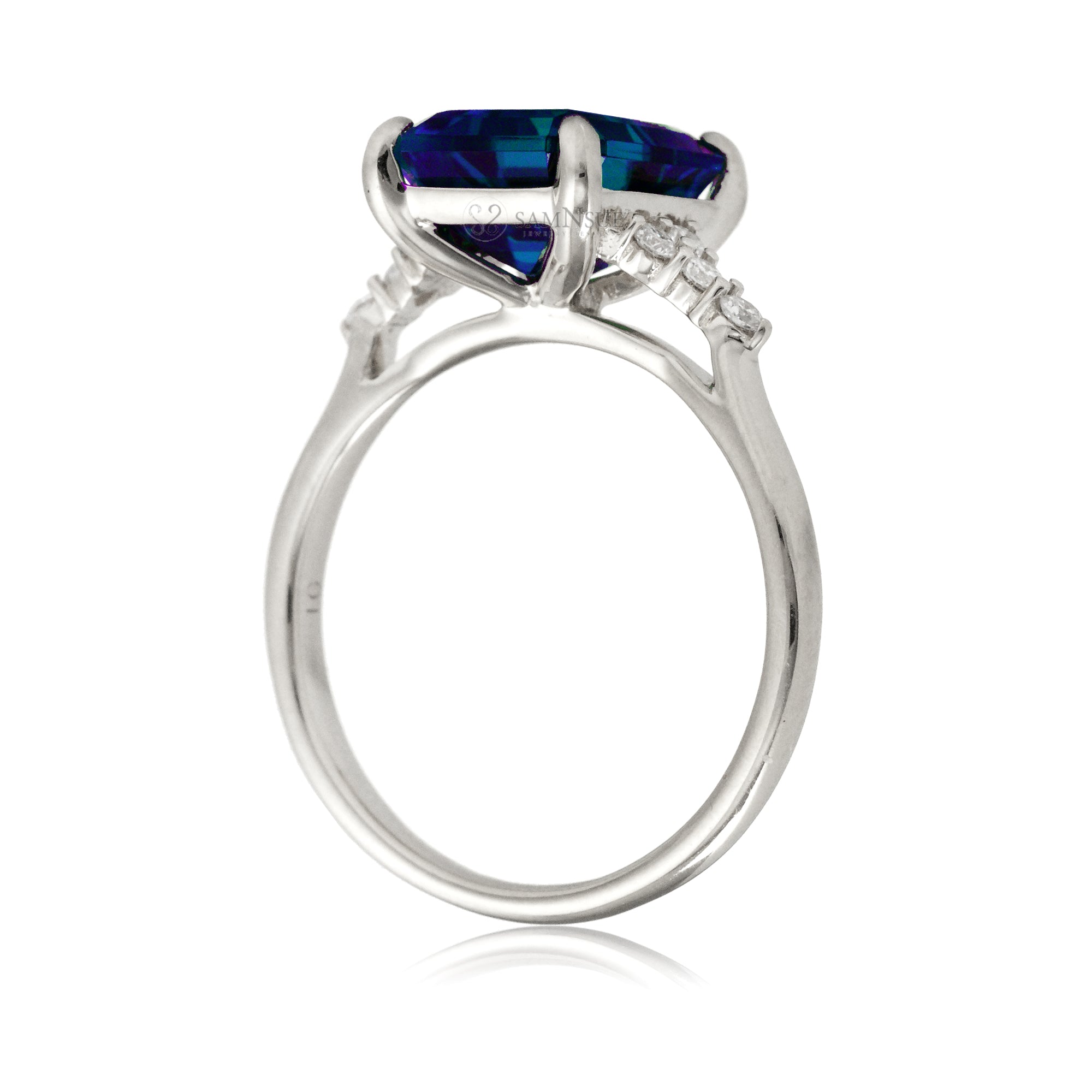 Sapphire engagement ring with a blue step emerald cut lab-grown sapphire and diamond accent in white gold